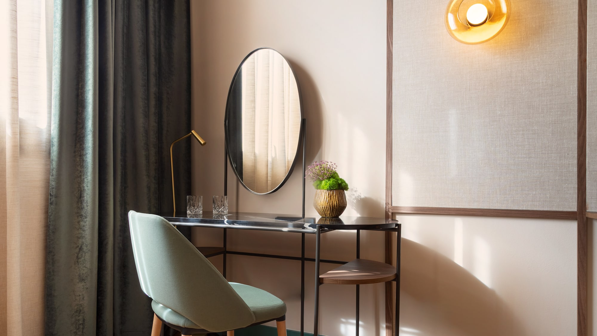 a desk with a chair and a mirror