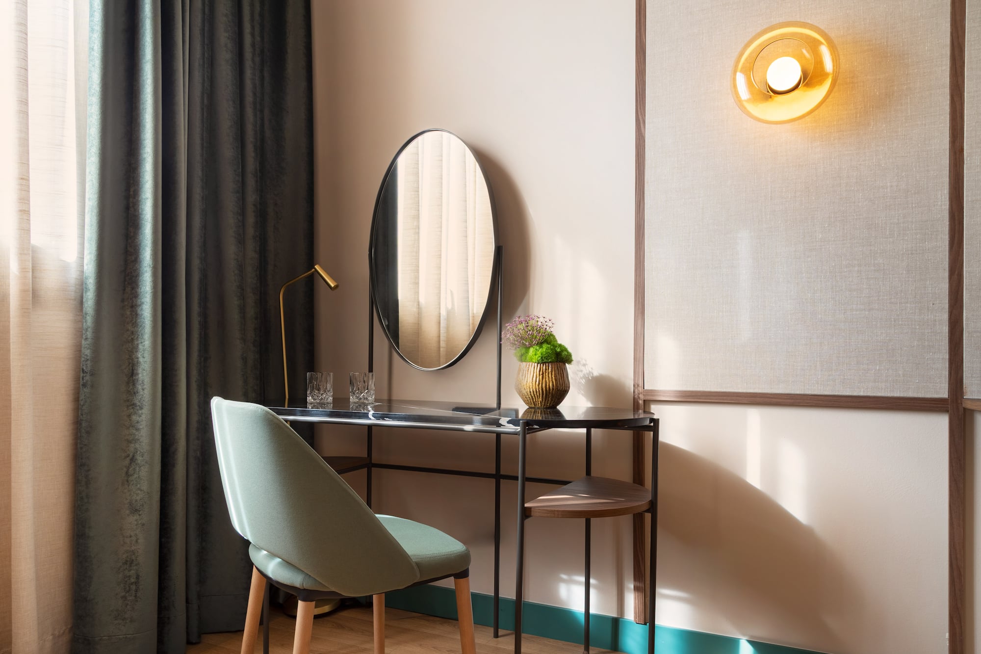 a desk with a chair and a mirror