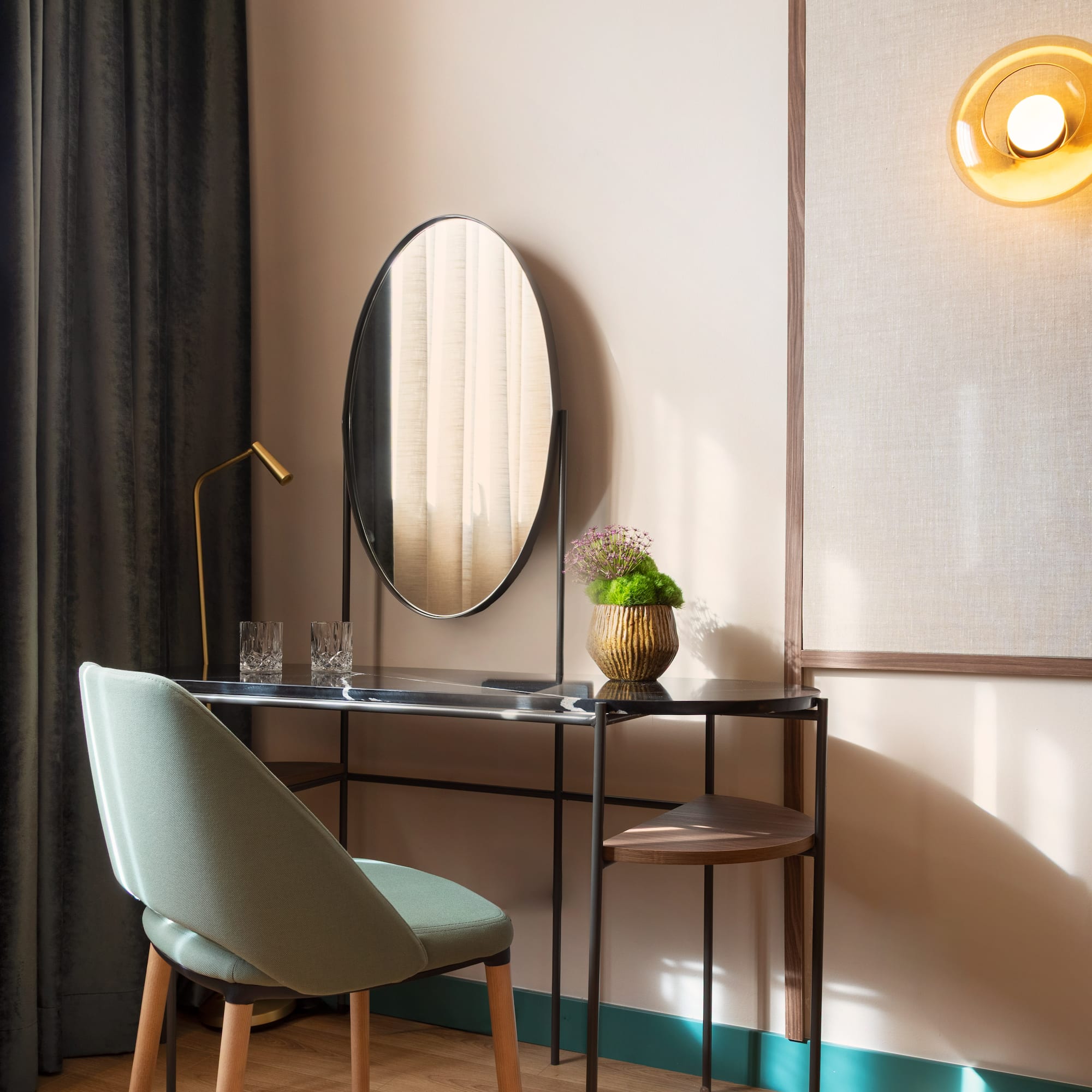 a desk with a chair and a mirror