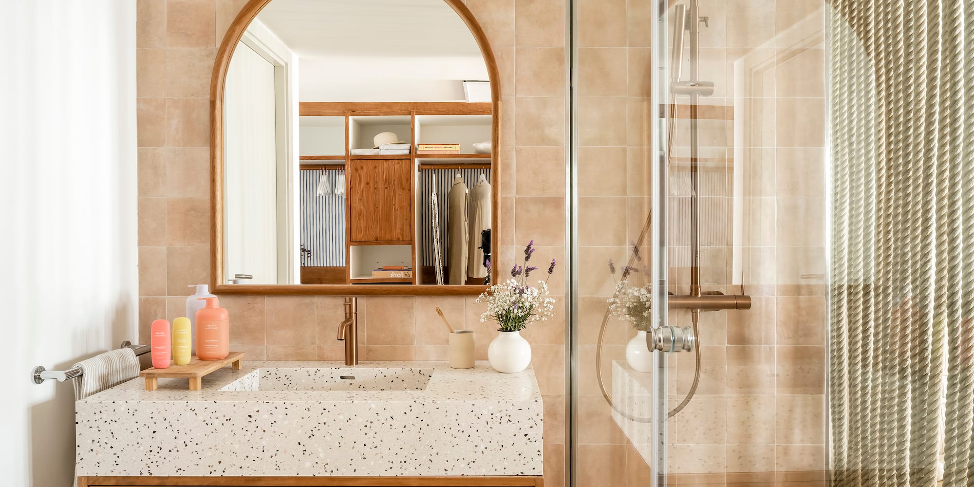 a bathroom with a glass shower door