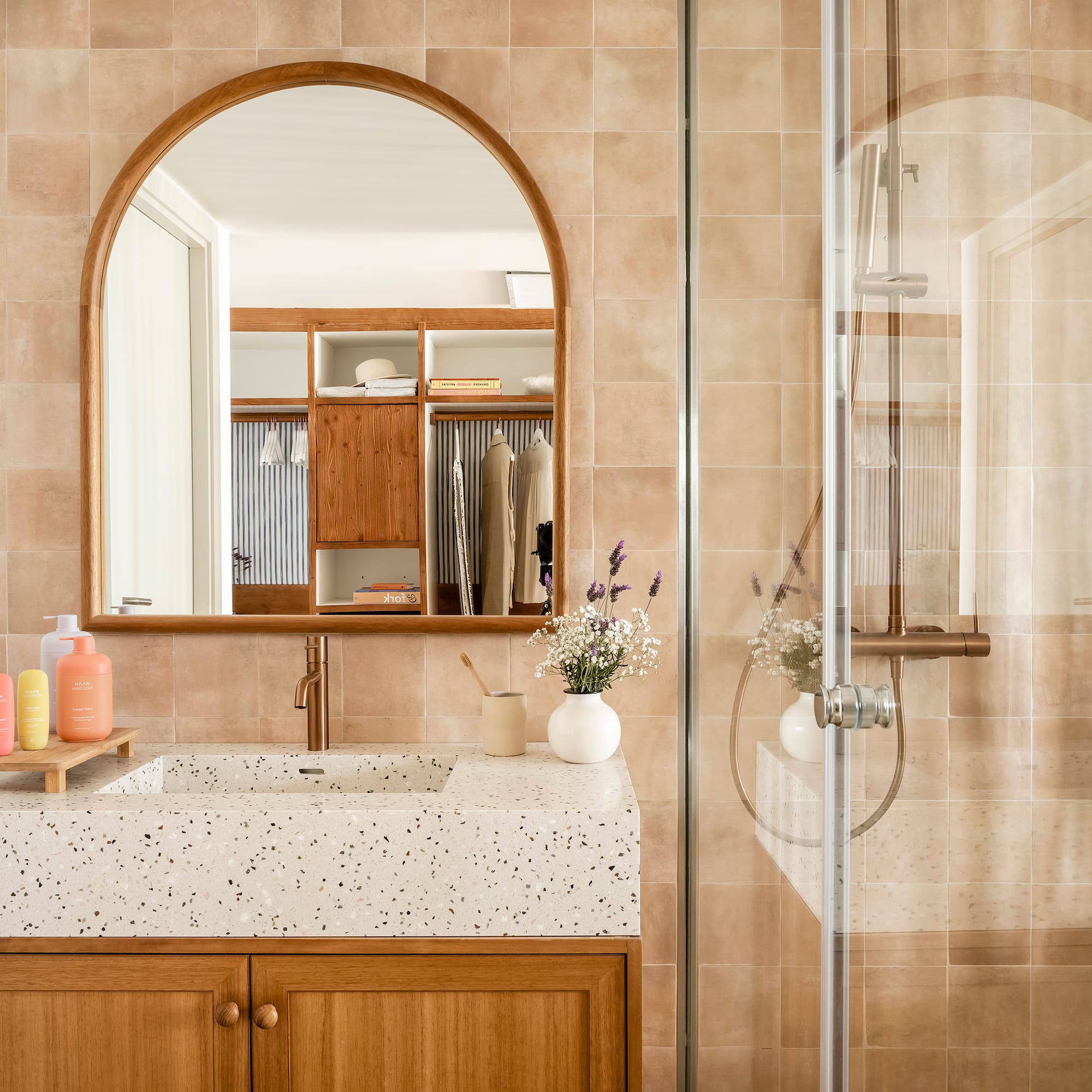 a bathroom with a glass shower door