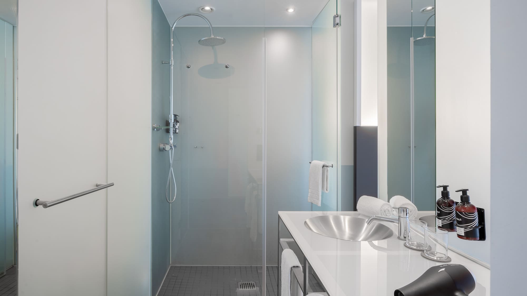 a bathroom with a shower and sink