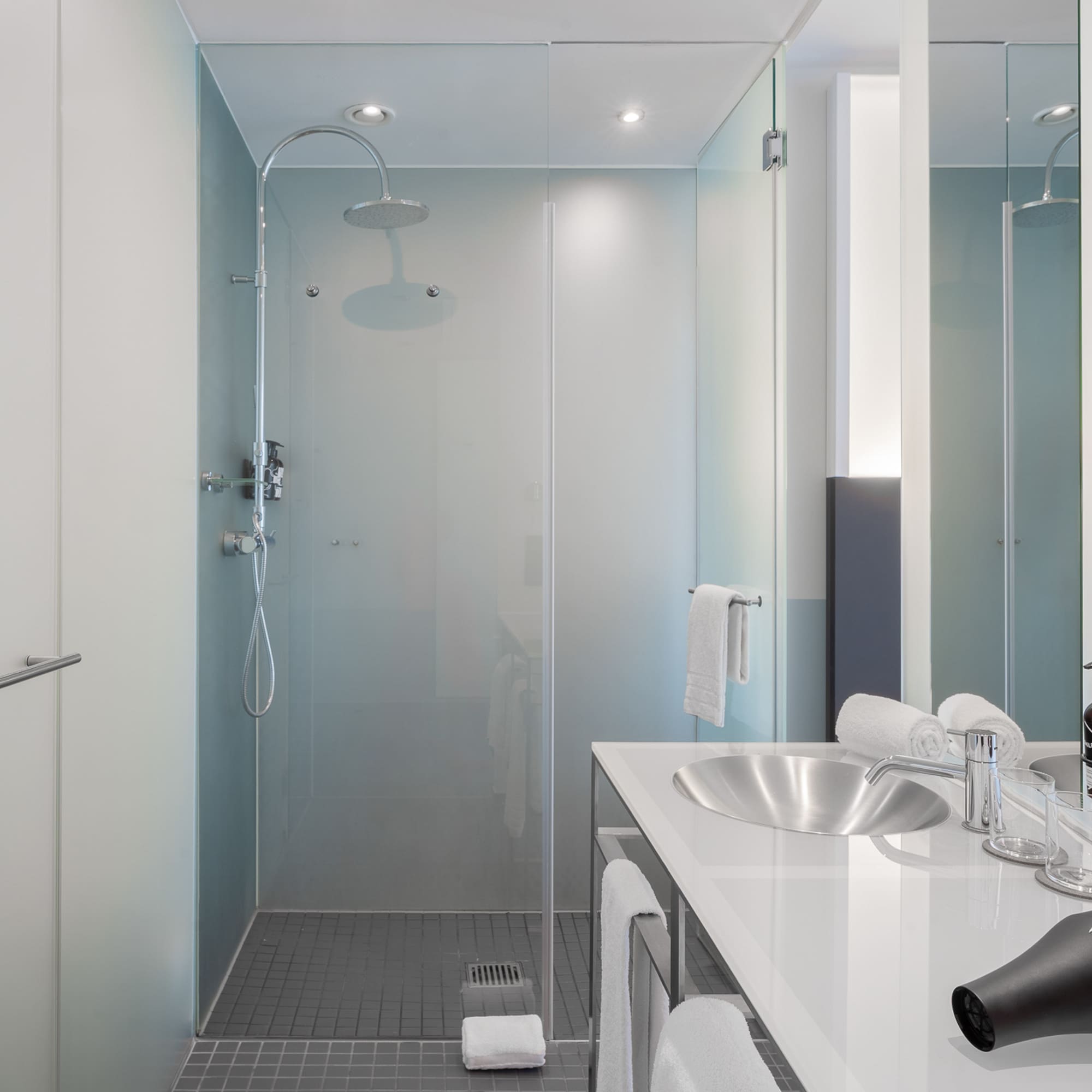 a bathroom with a shower and sink