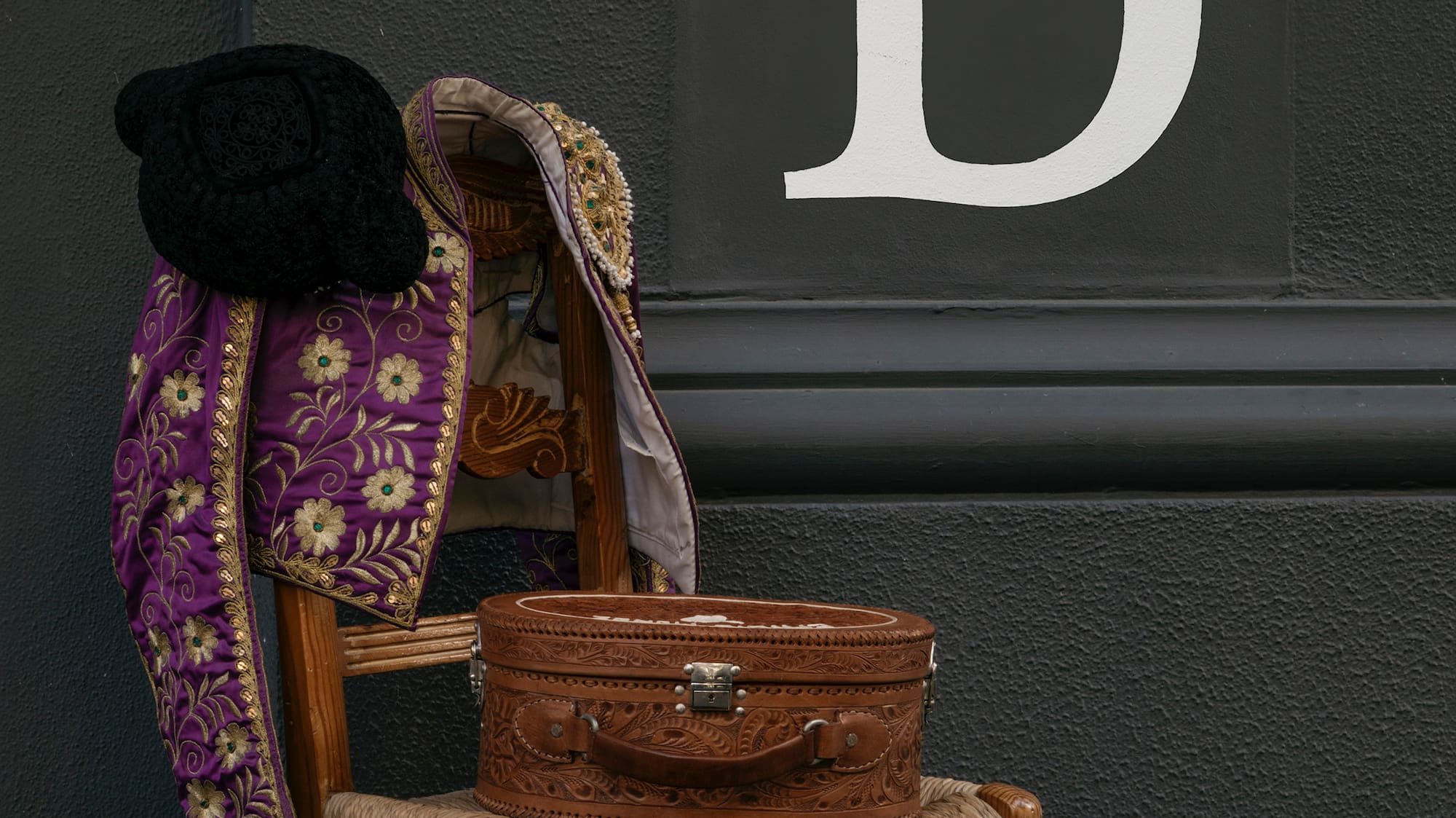 a chair with a hat and a coat on it