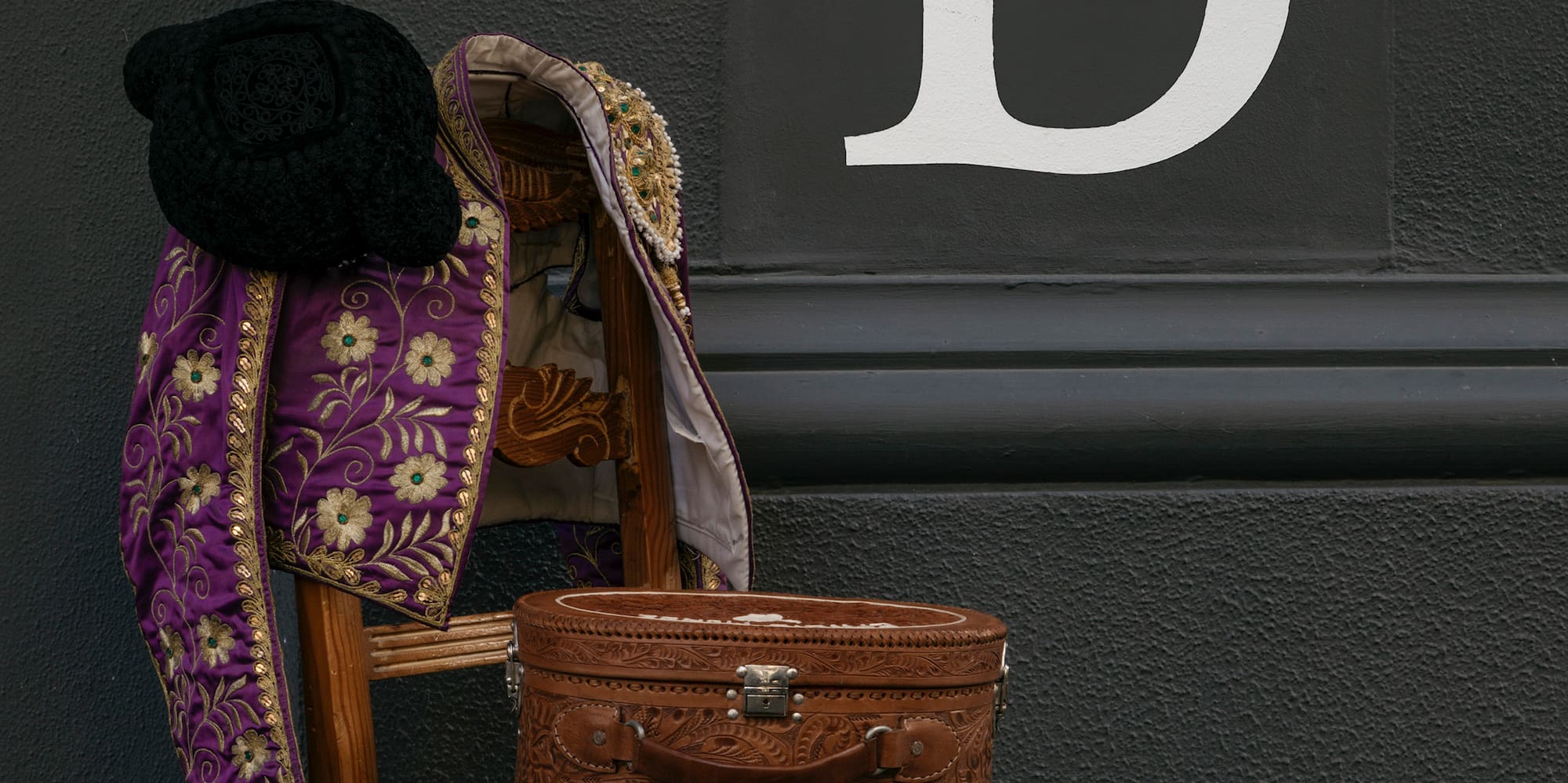 a chair with a hat and a coat on it