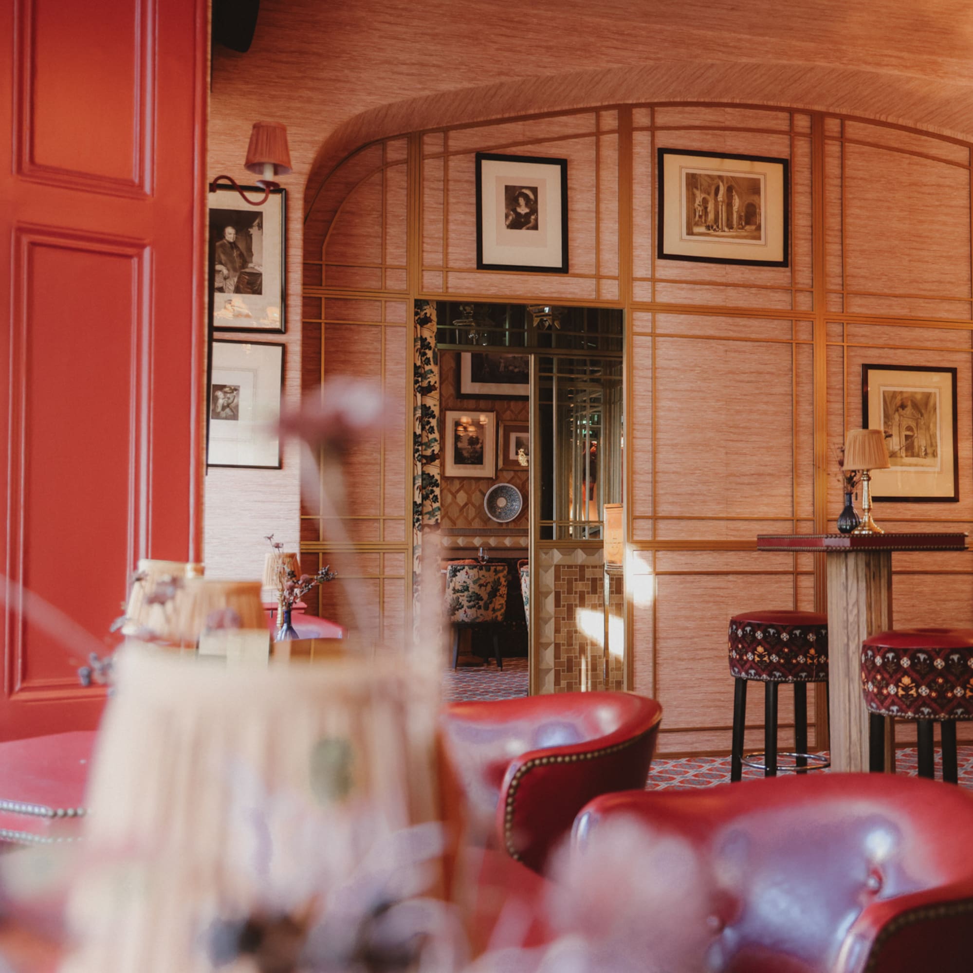 a room with red chairs and tables