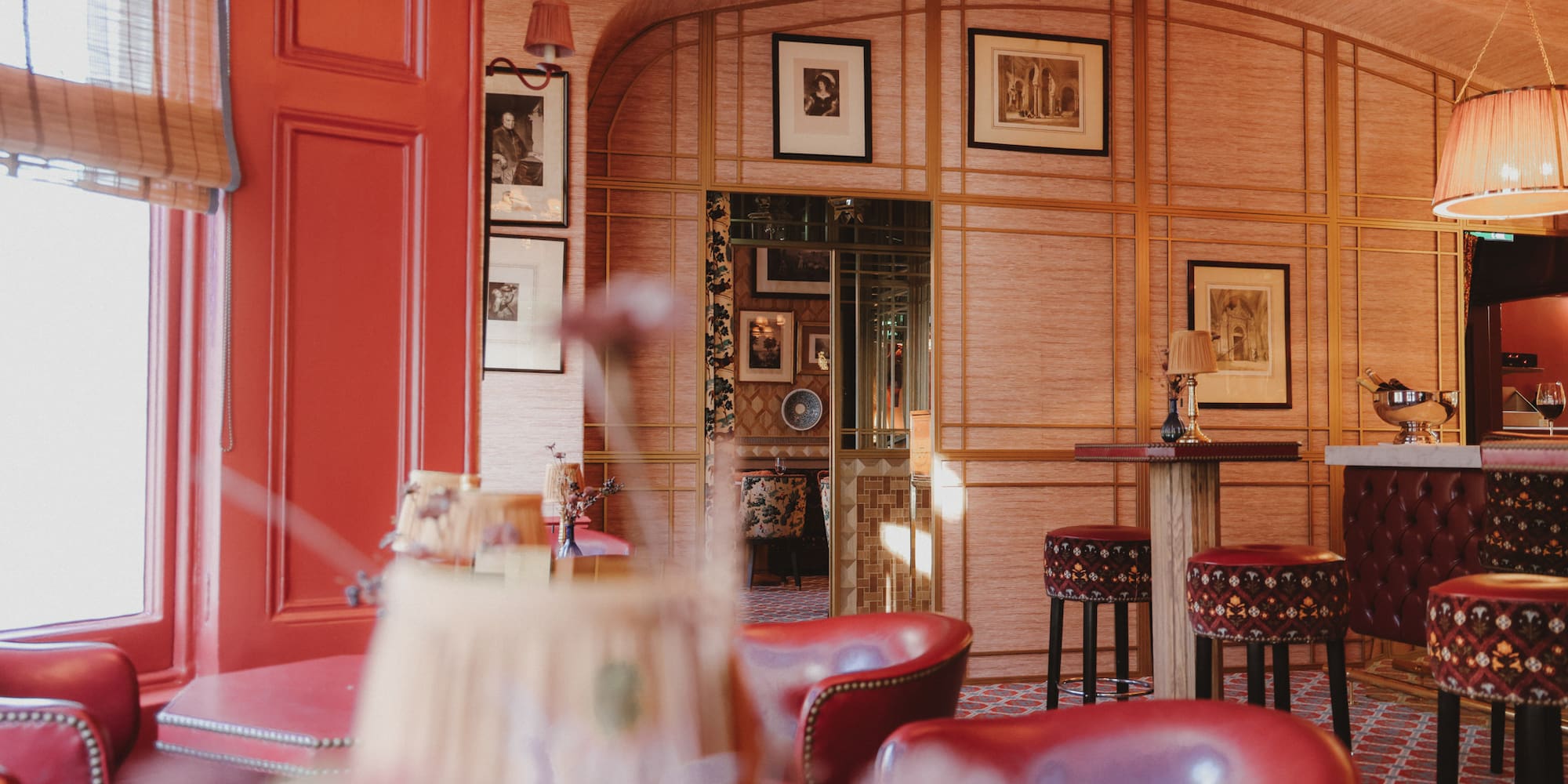 a room with red chairs and tables