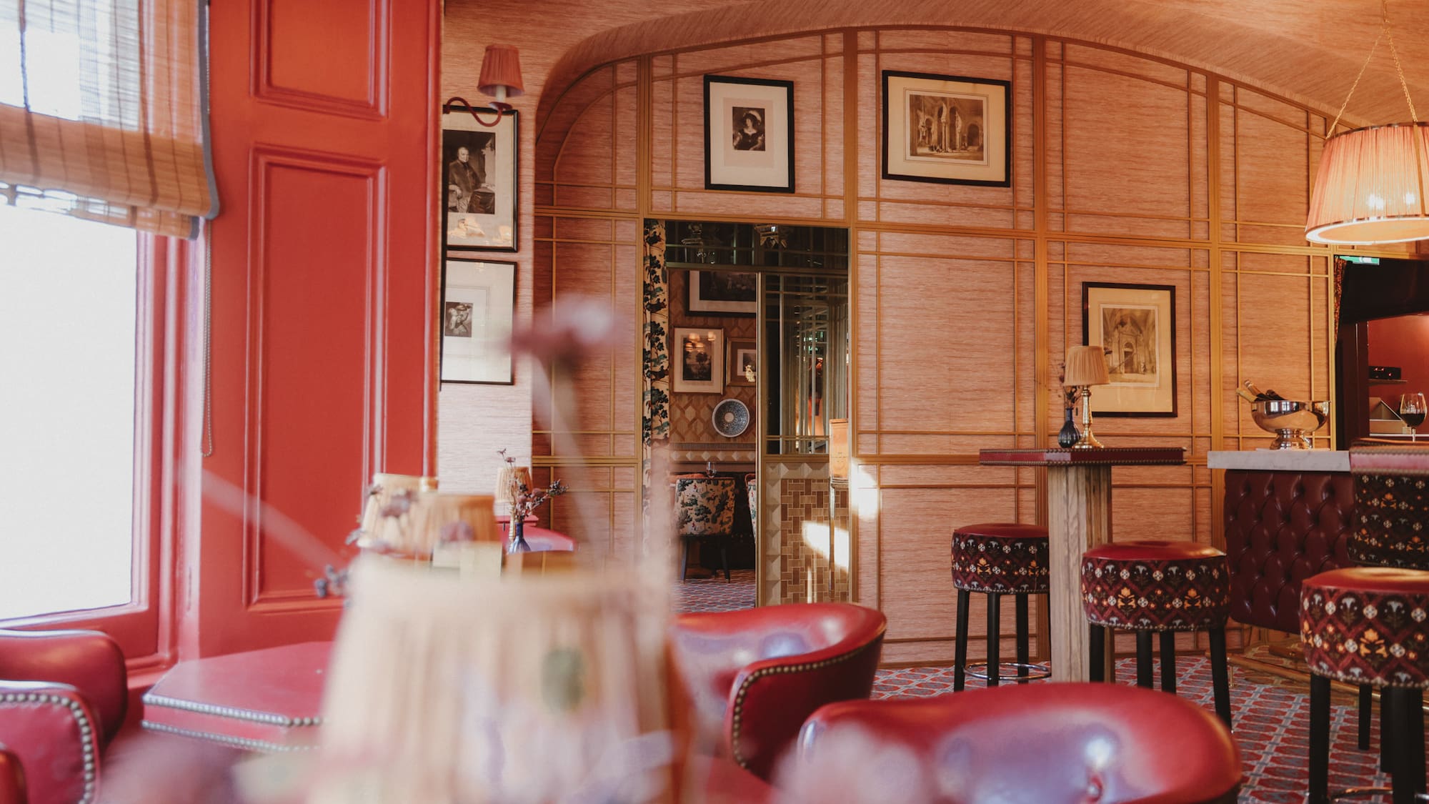 a room with red chairs and tables