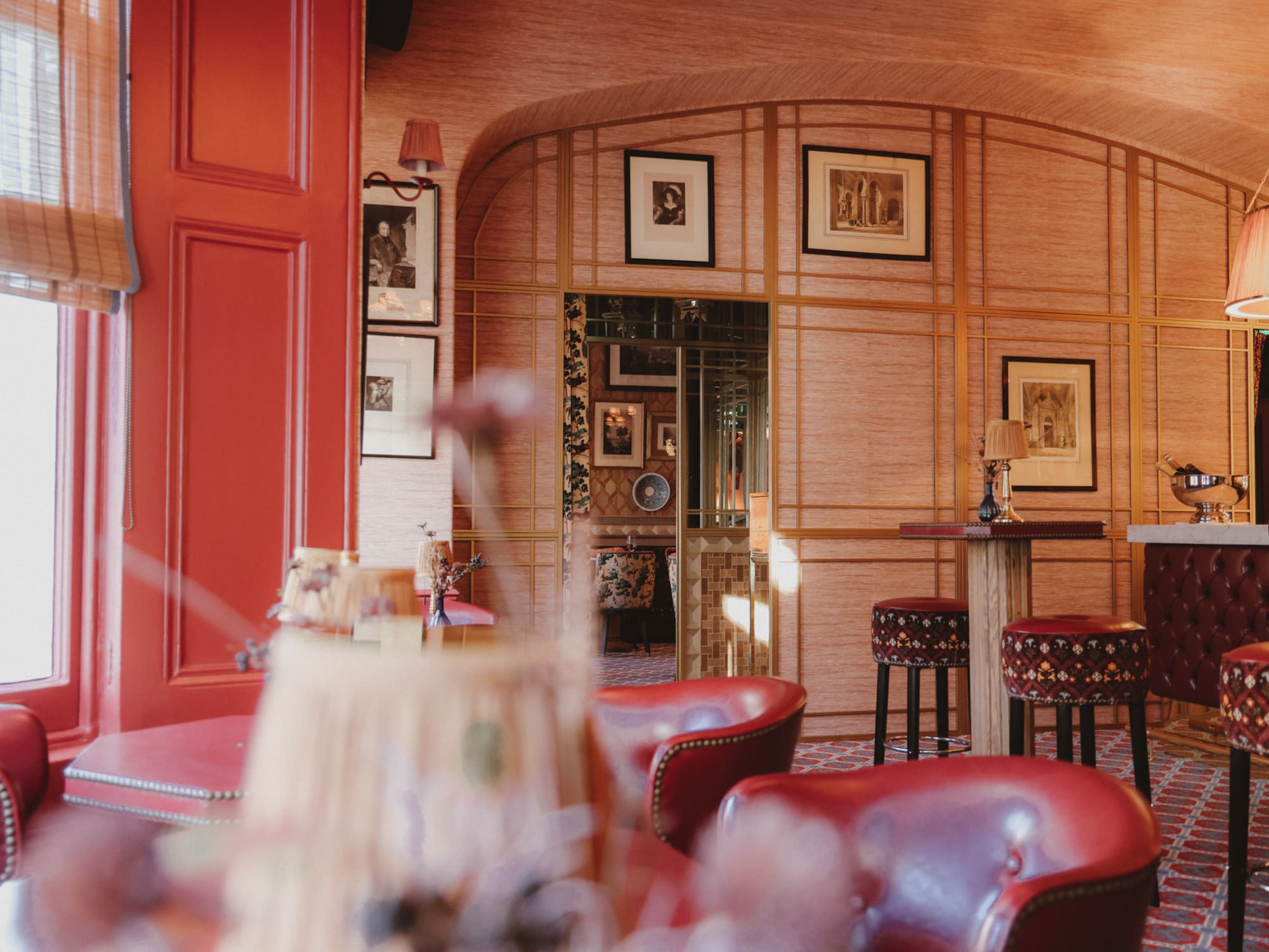 a room with red chairs and tables