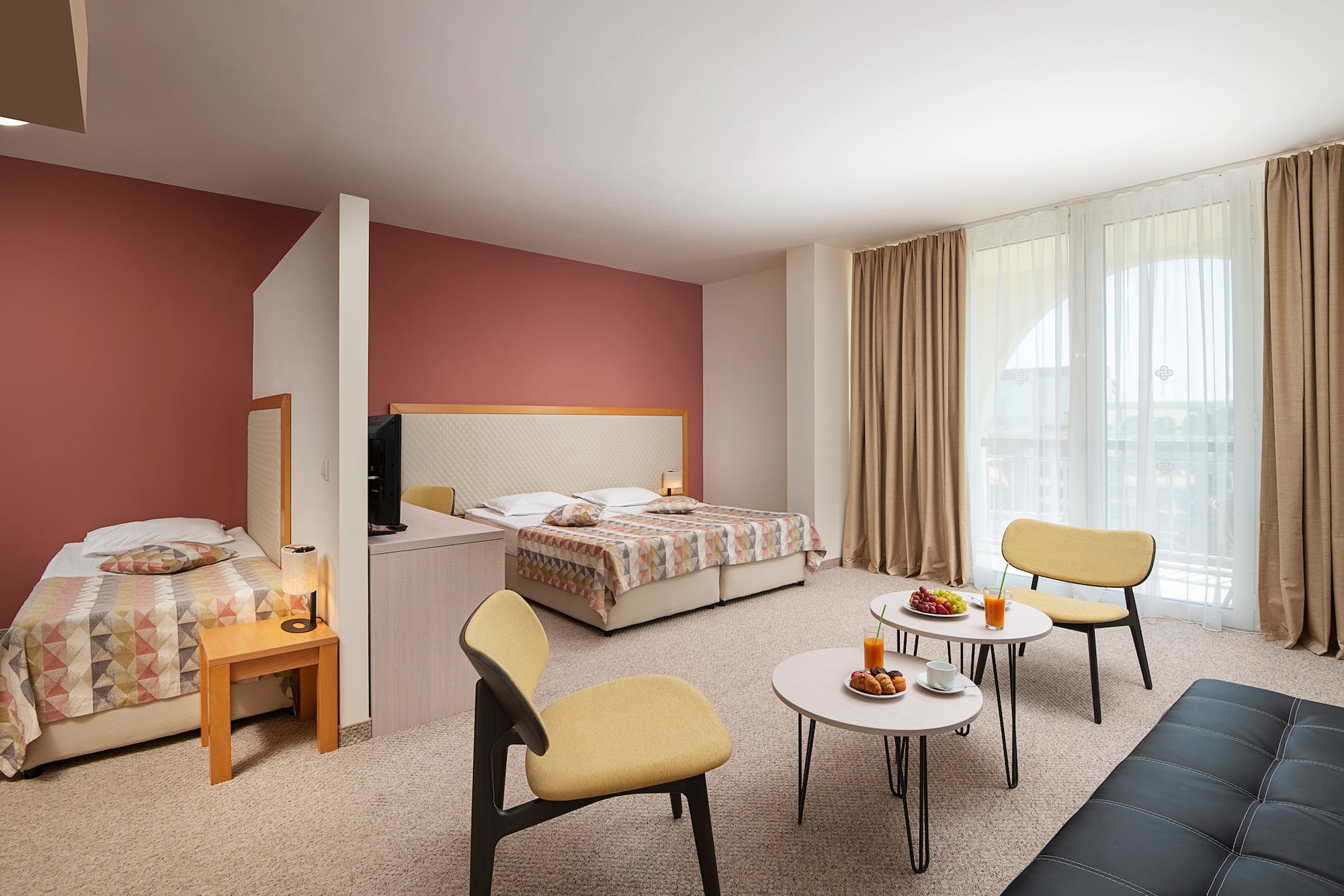 a room with a bed and a tv