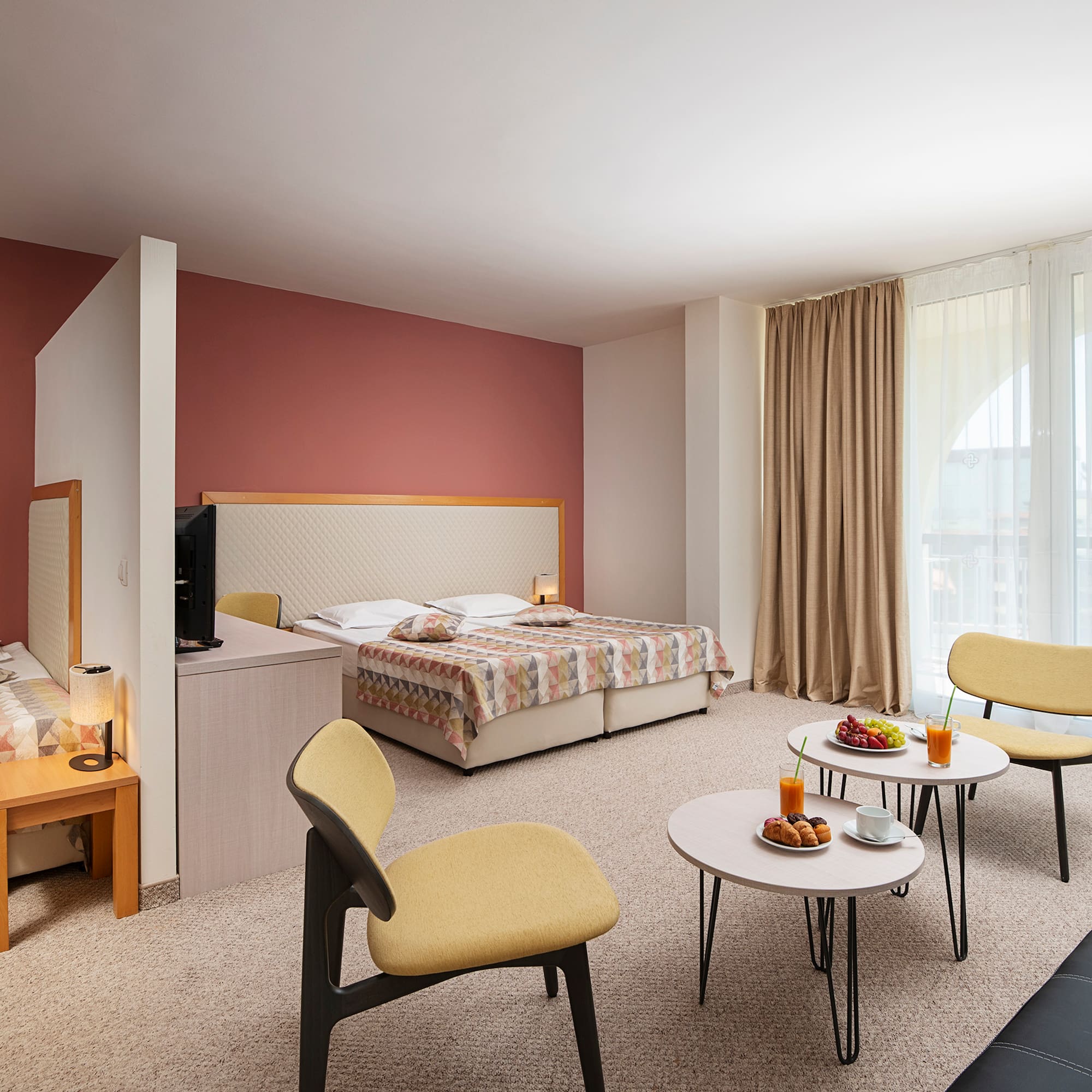 a room with a bed and a tv