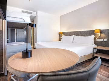 a room with a bed and a table