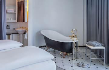 a bathroom with a bathtub and a sink