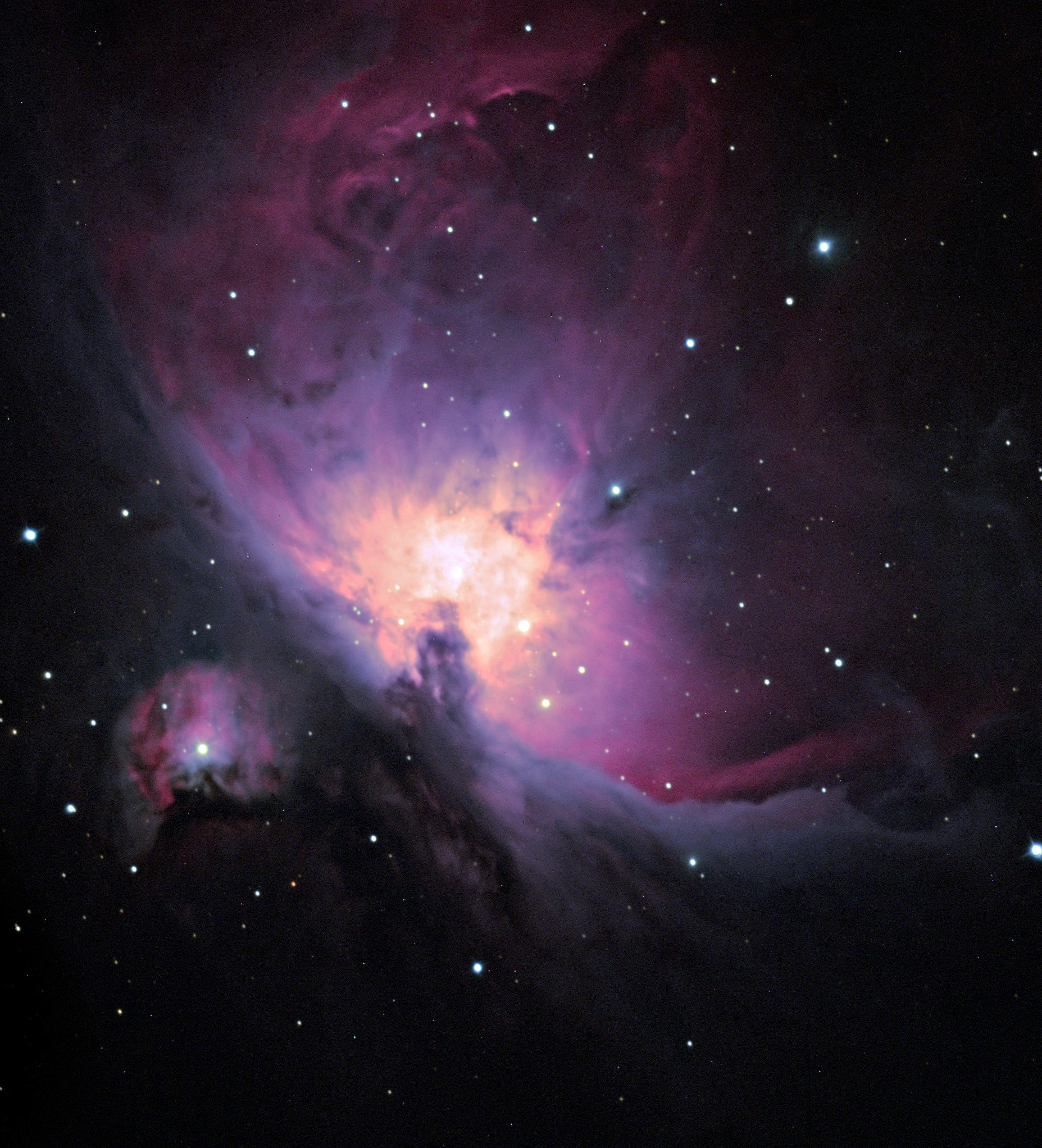 a purple and pink nebula in space
