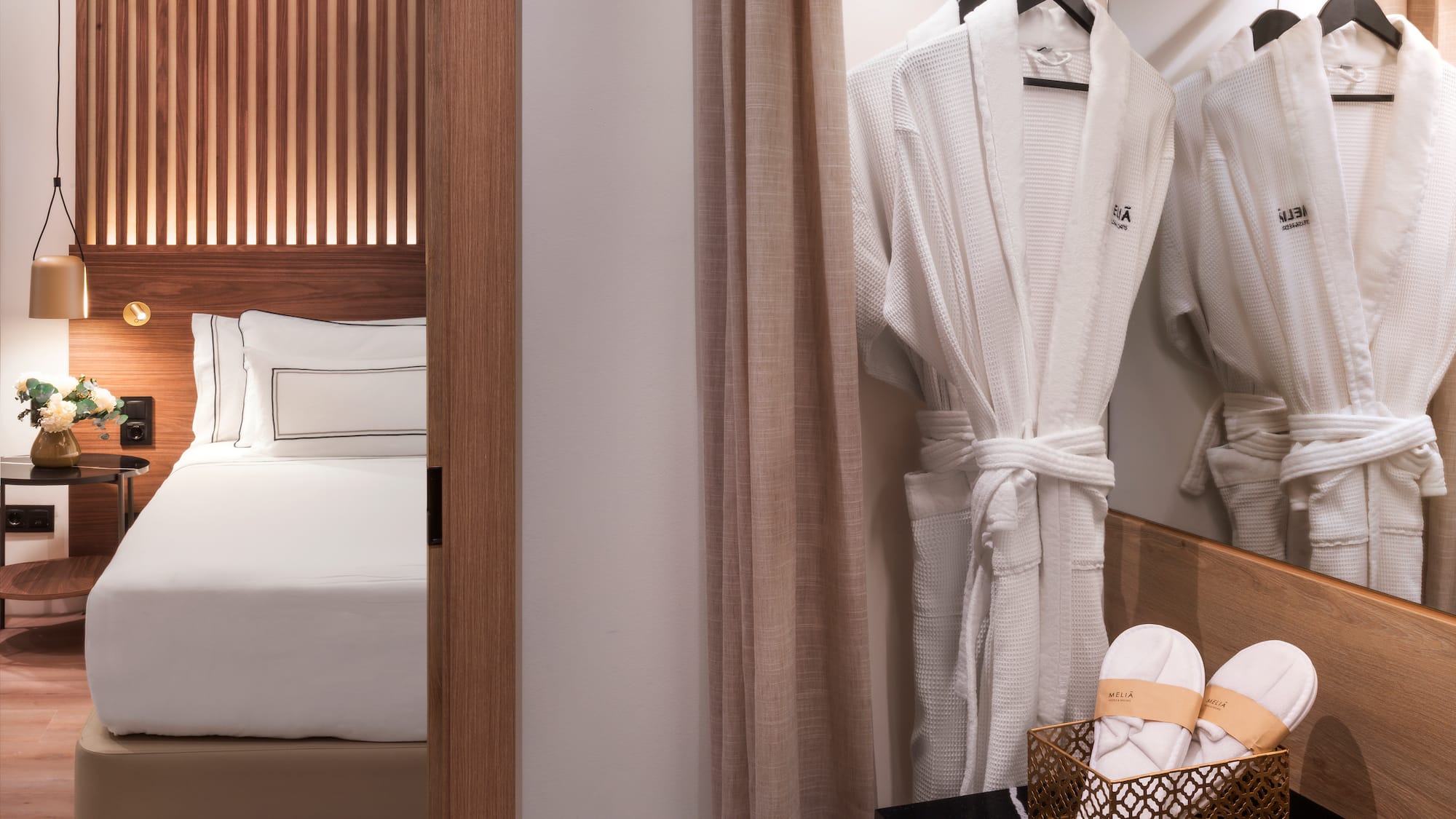 a white robe on a swinger in a hotel room