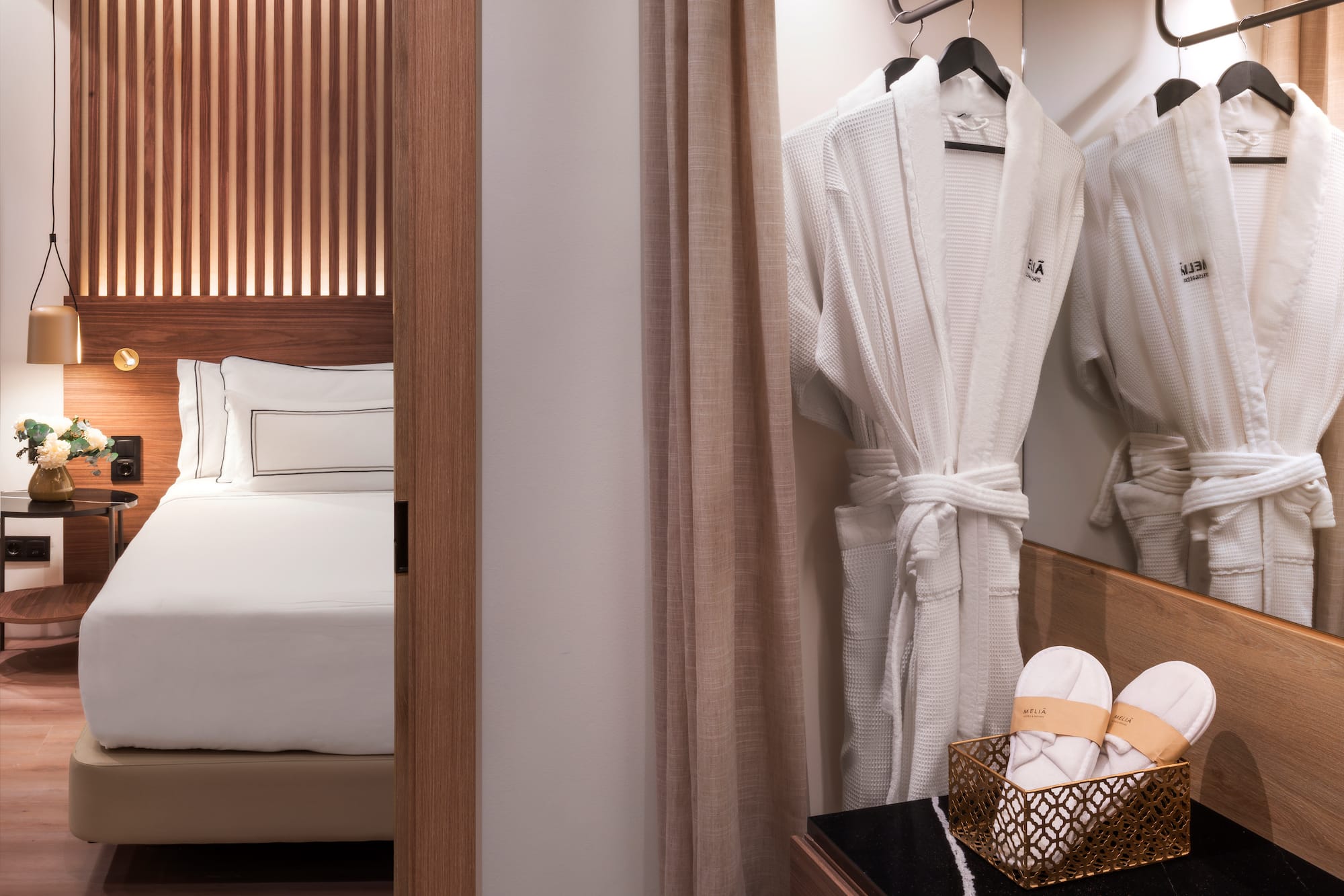 a white robe on a swinger in a hotel room