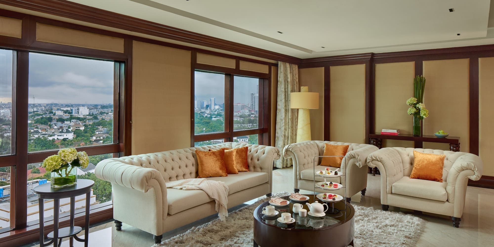 a living room with couches and coffee table