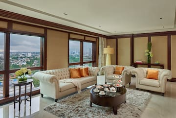 a living room with couches and coffee table