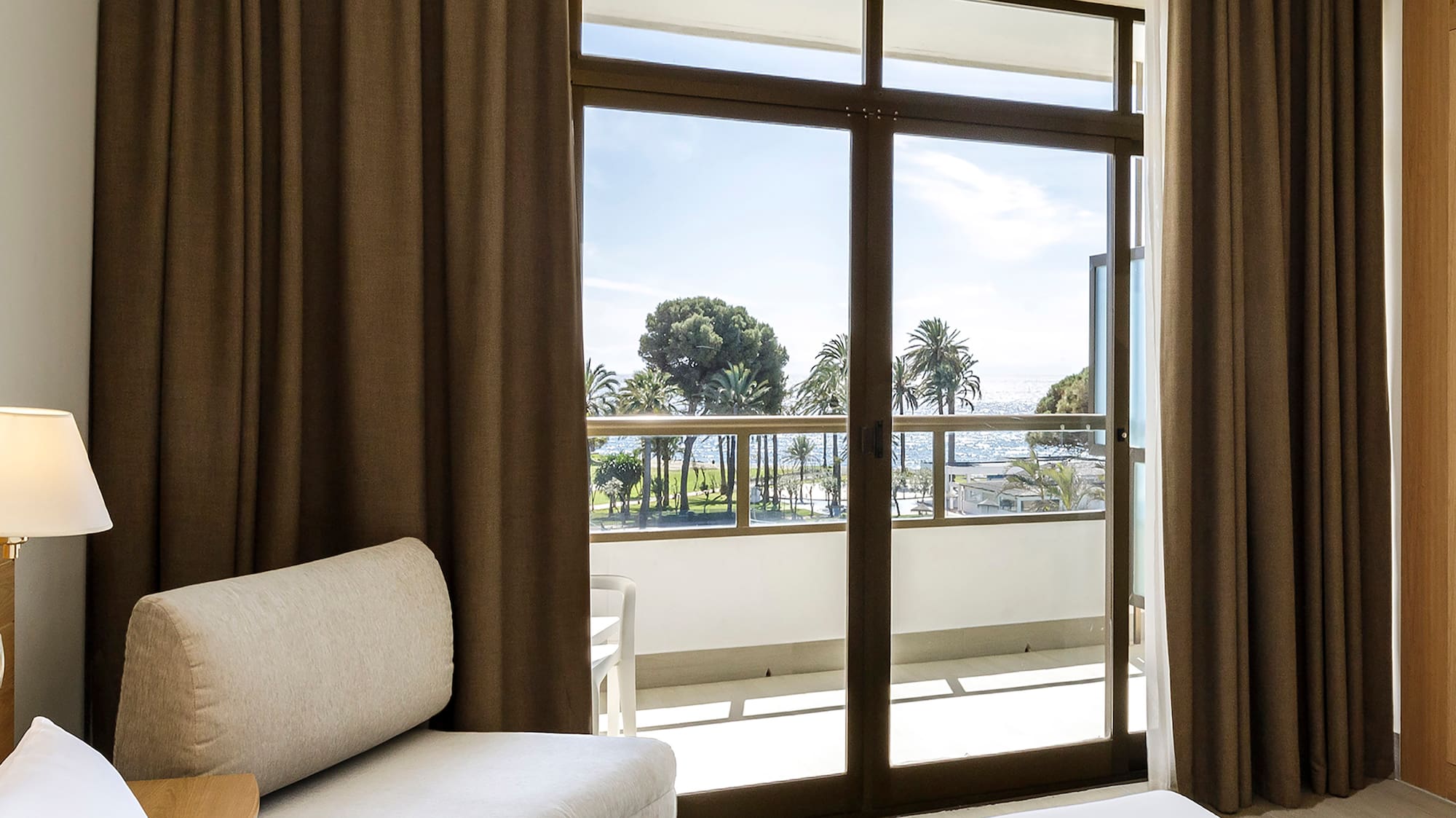 a room with a bed and a chair