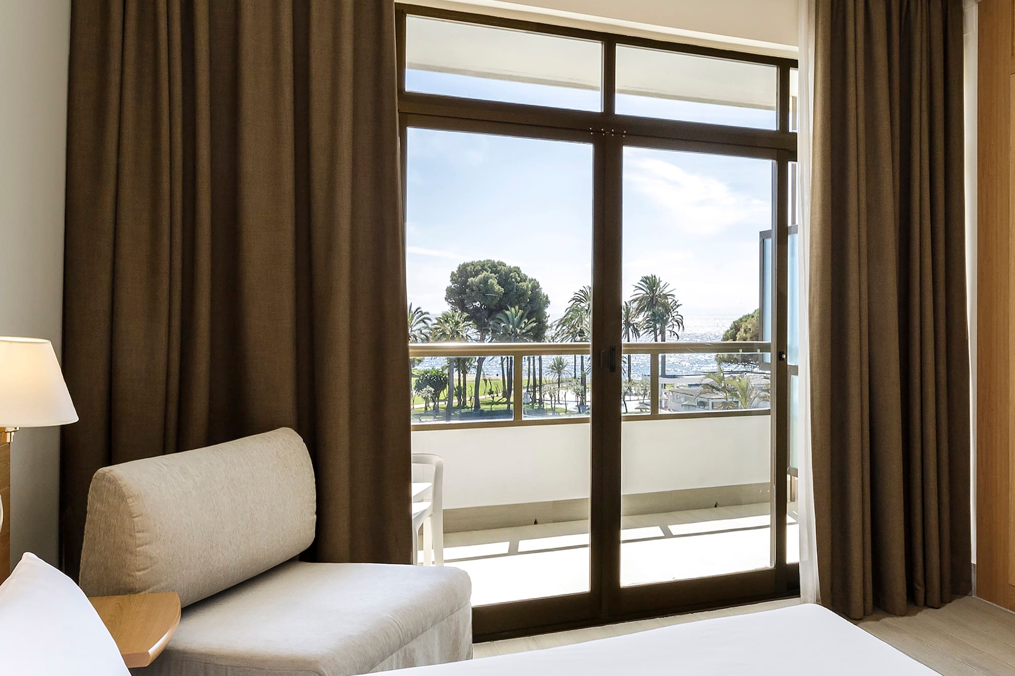 a room with a bed and a chair