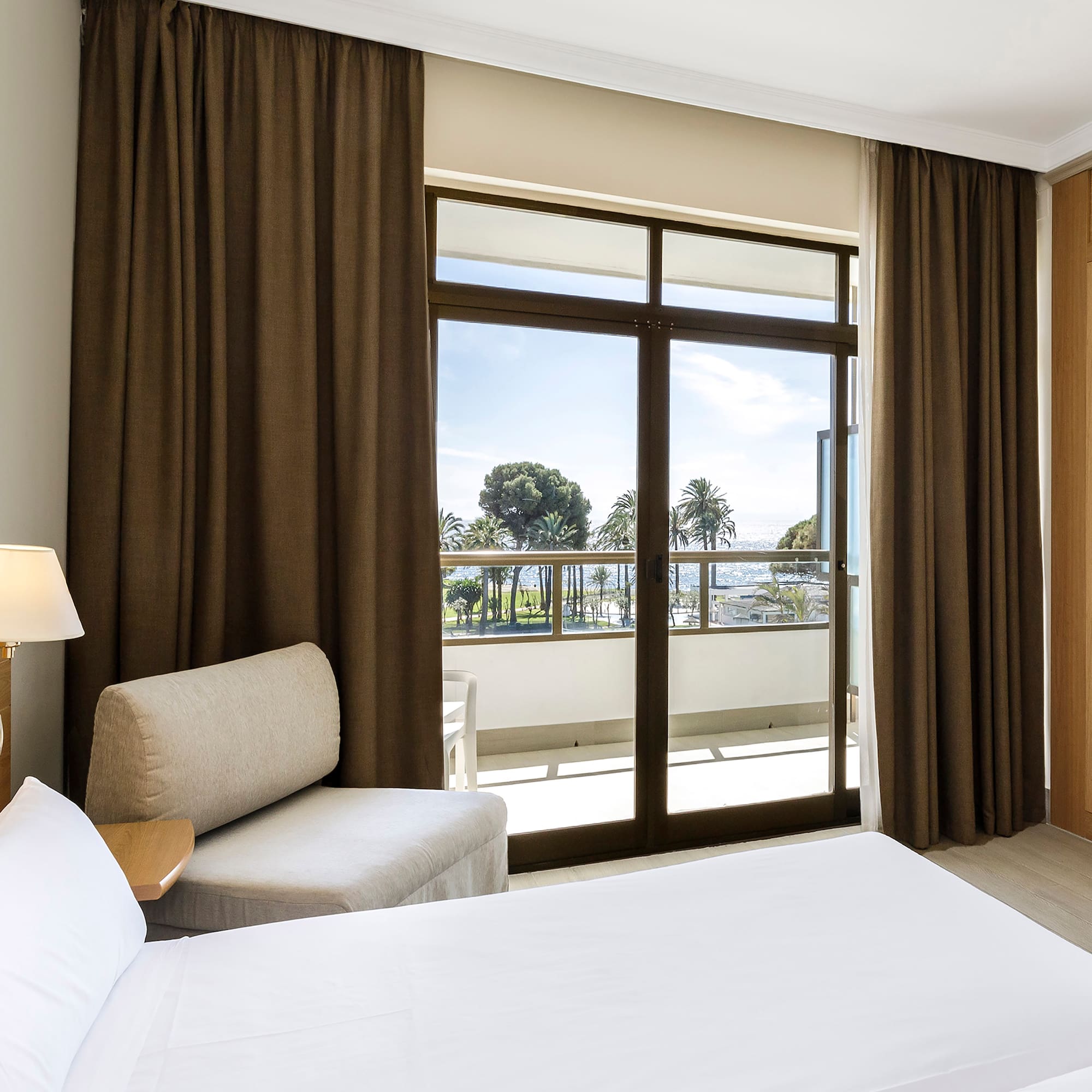 a room with a bed and a chair