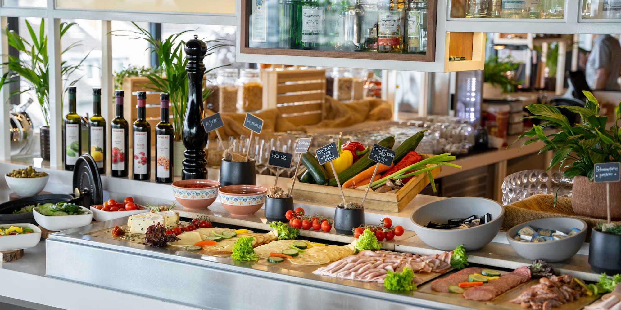 Hotel breakfast buffet featuring fresh vegetables, cheese, and cold cuts.