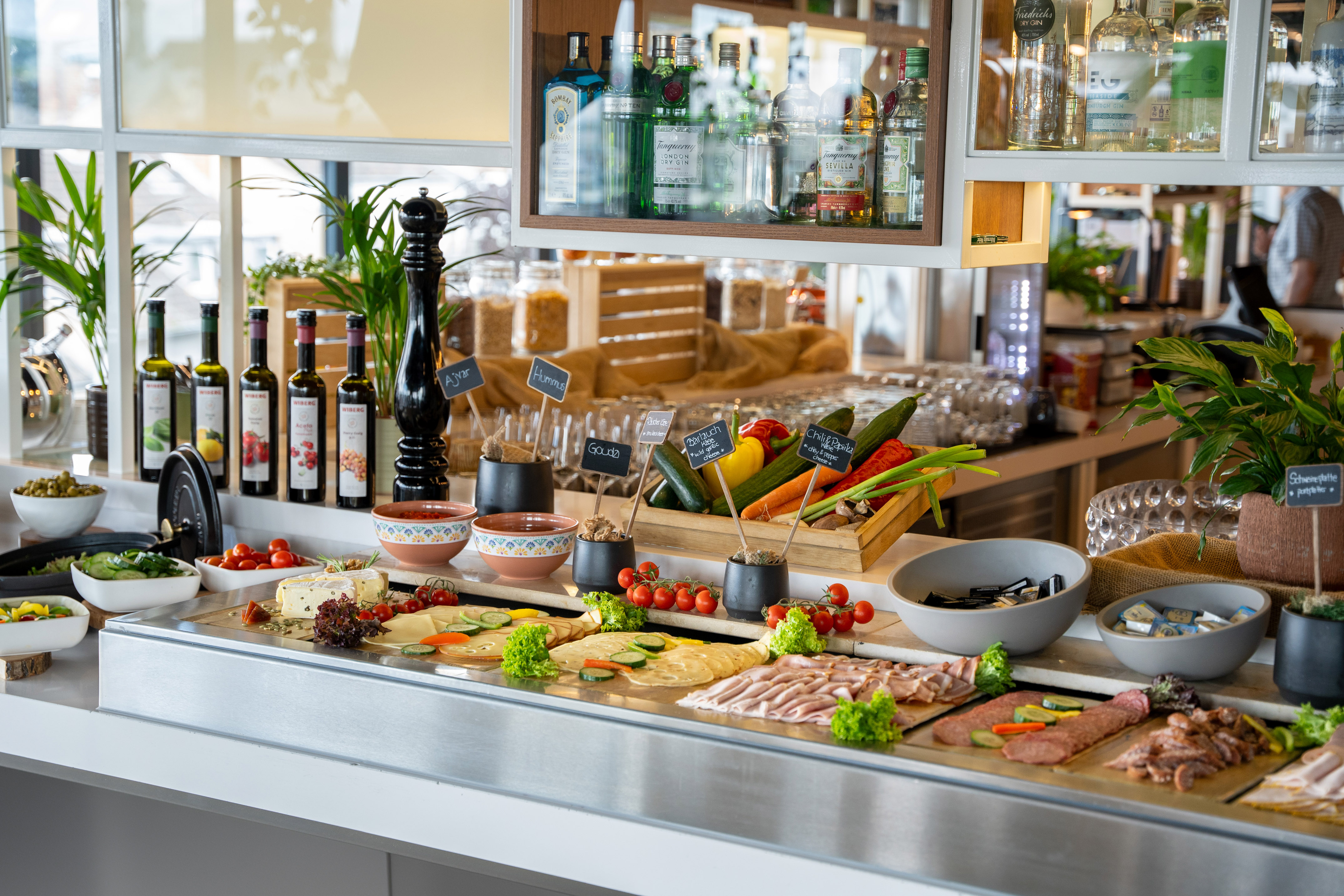 Hotel breakfast buffet featuring fresh vegetables, cheese, and cold cuts.