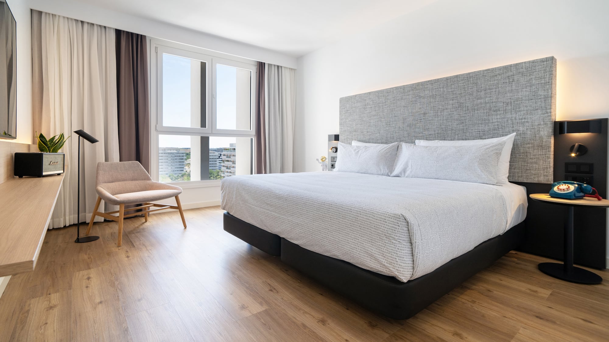 a bedroom with a bed and a chair