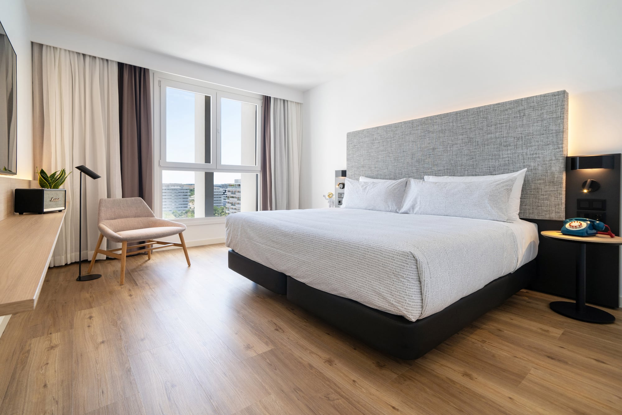 a bedroom with a bed and a chair