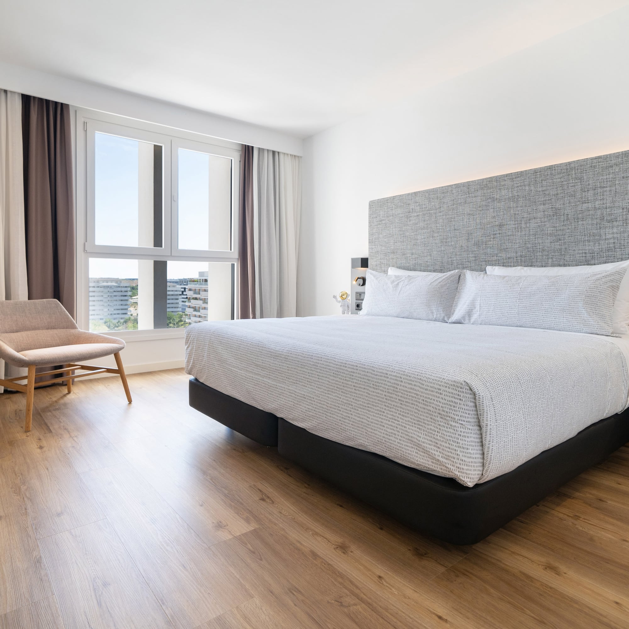 a bedroom with a bed and a chair