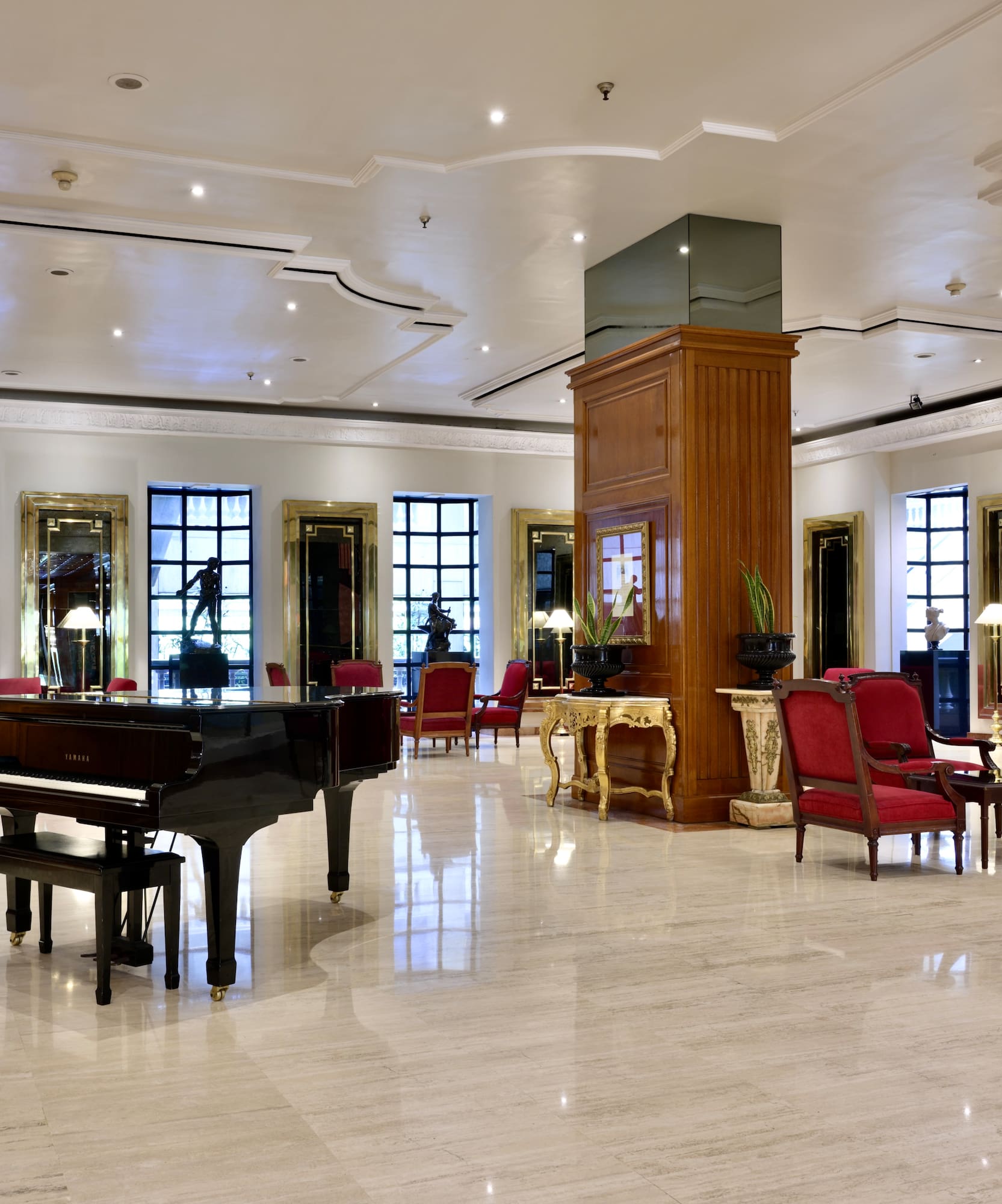 a room with a piano and chairs