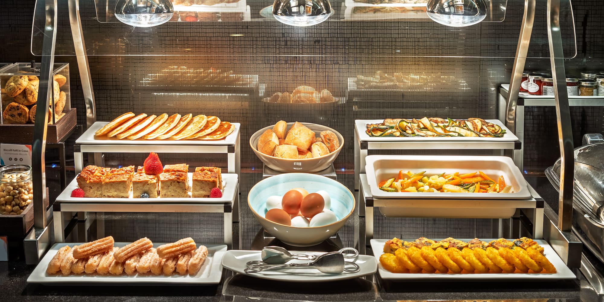 a buffet with different food items on it