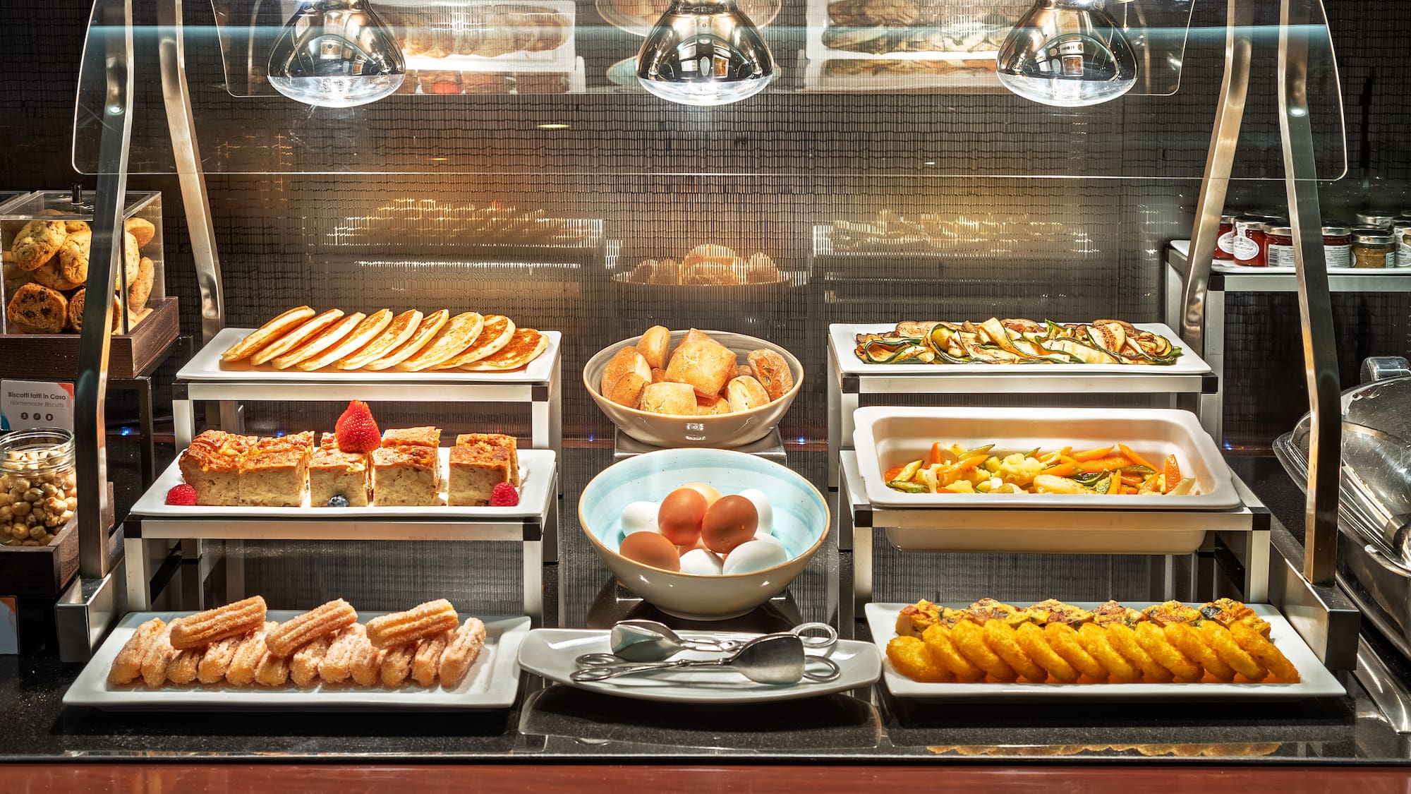 a buffet with different food items on it