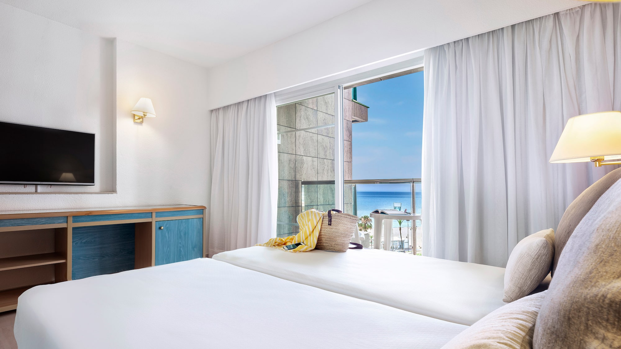 a room with a bed and a television