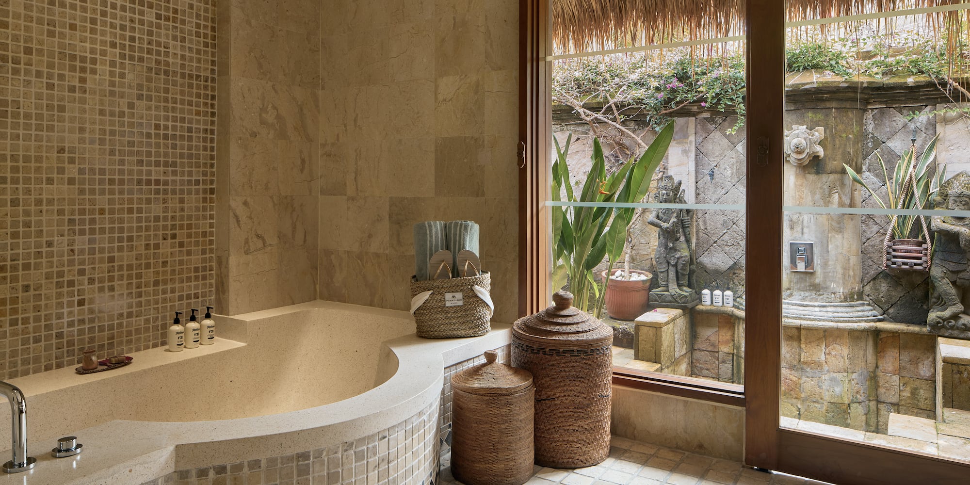 a bathroom with a tub and a glass door