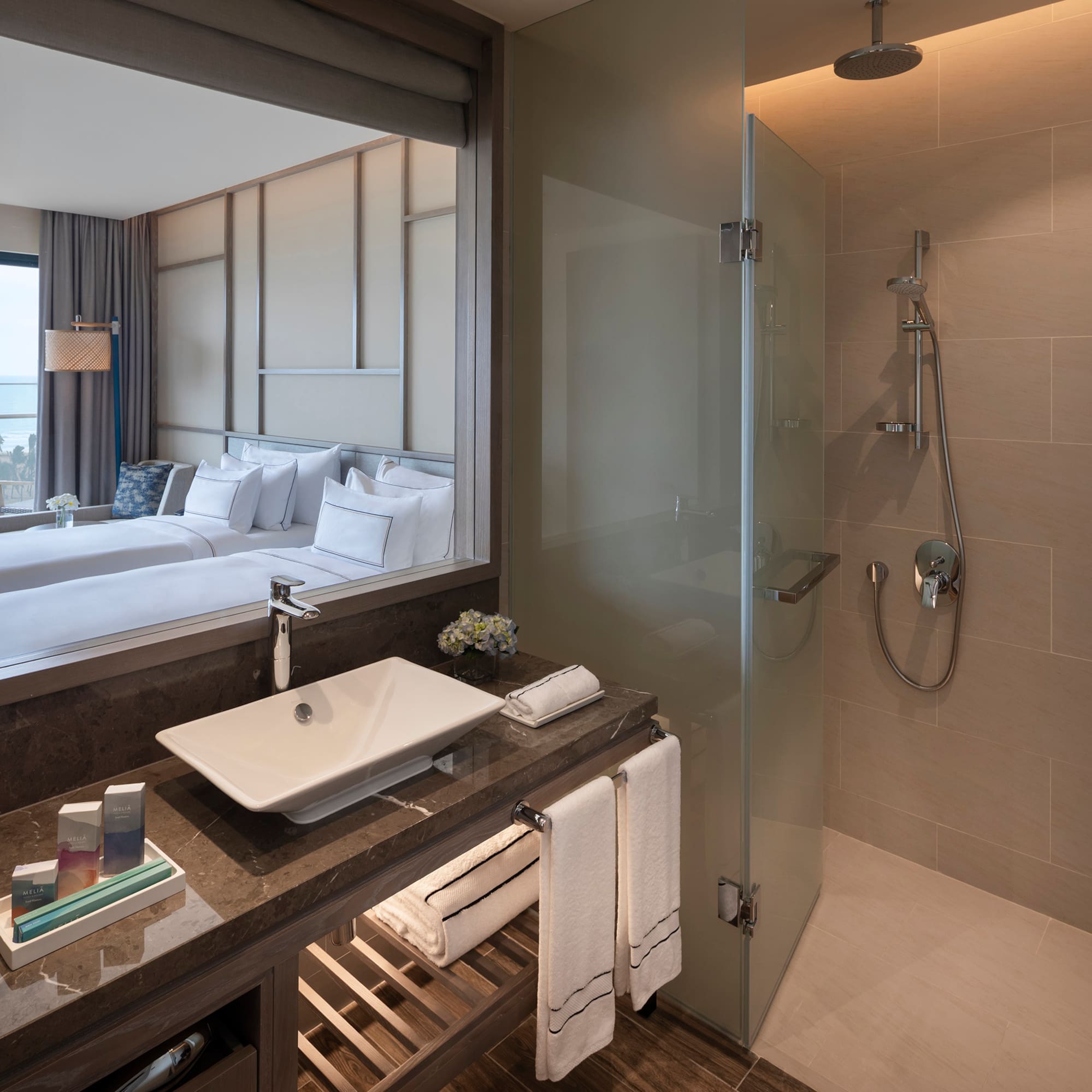 a bathroom with a mirror and a sink