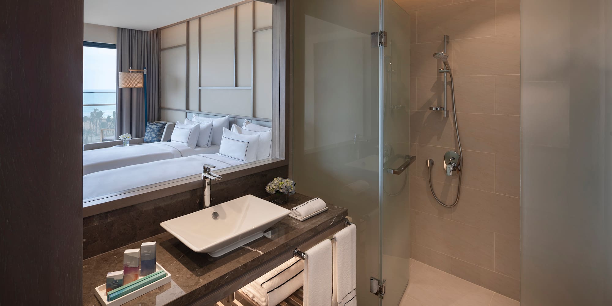 a bathroom with a mirror and a sink