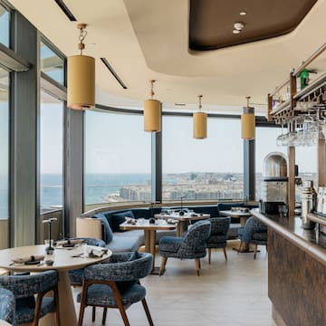 a restaurant with a view of the ocean