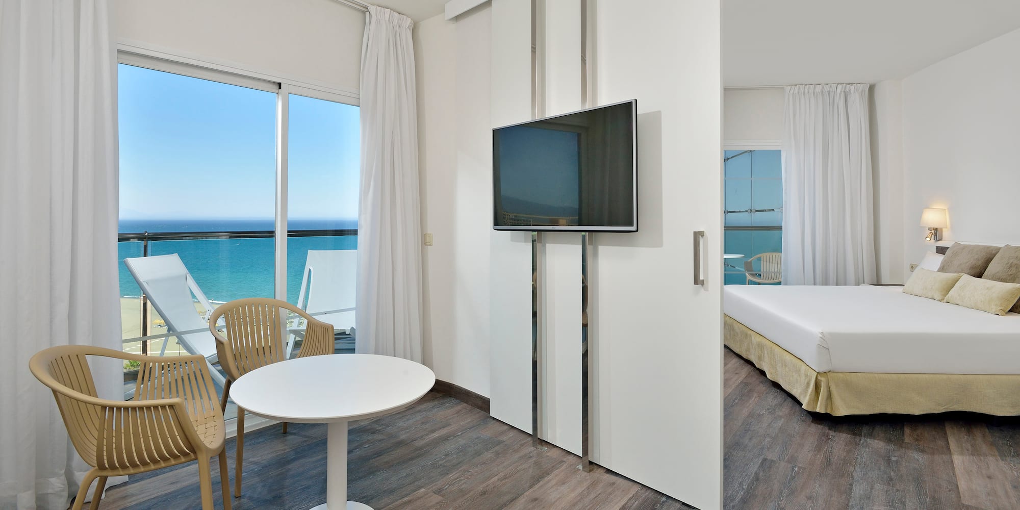 a room with a television and a bed