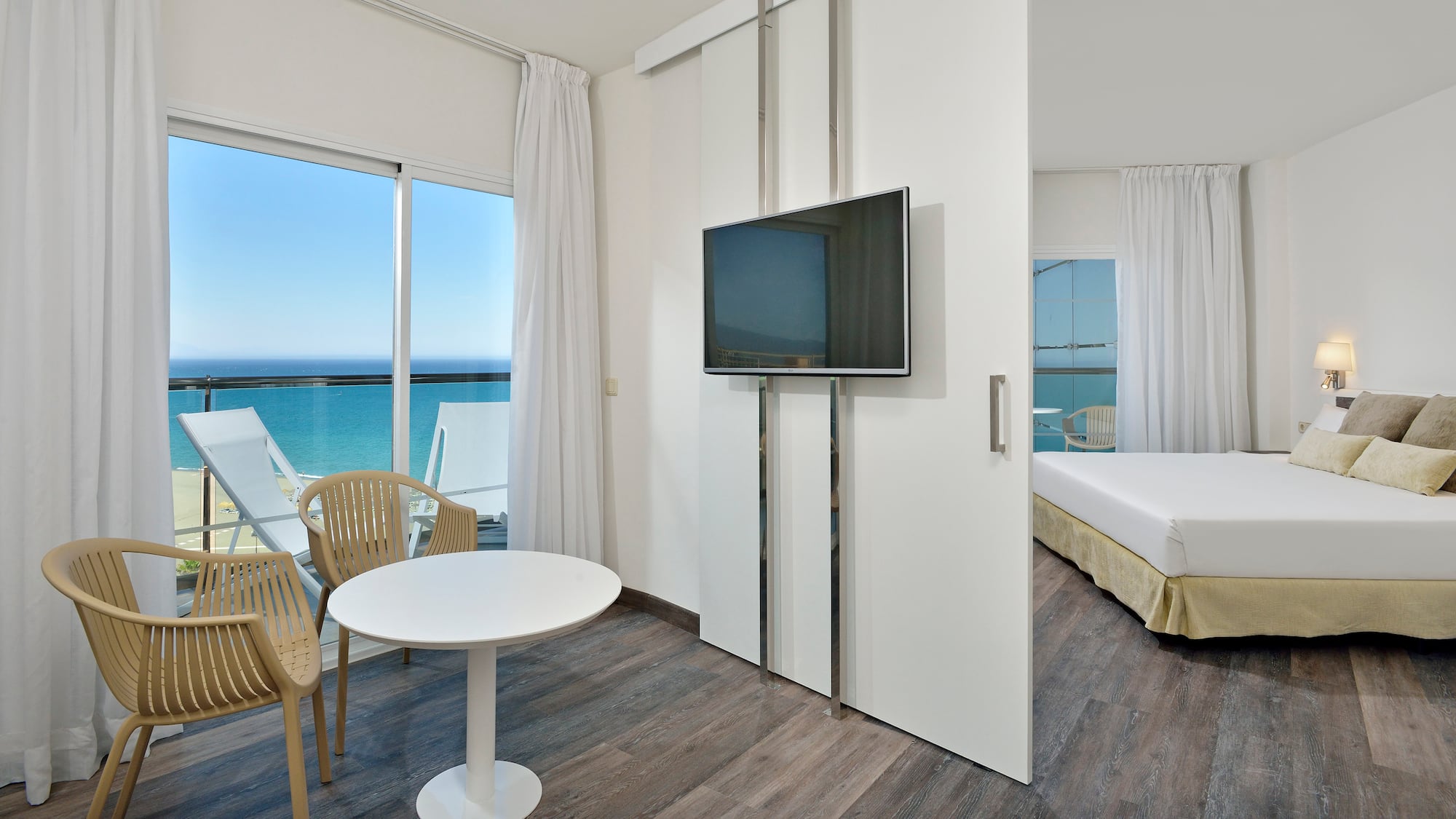 a room with a television and a bed