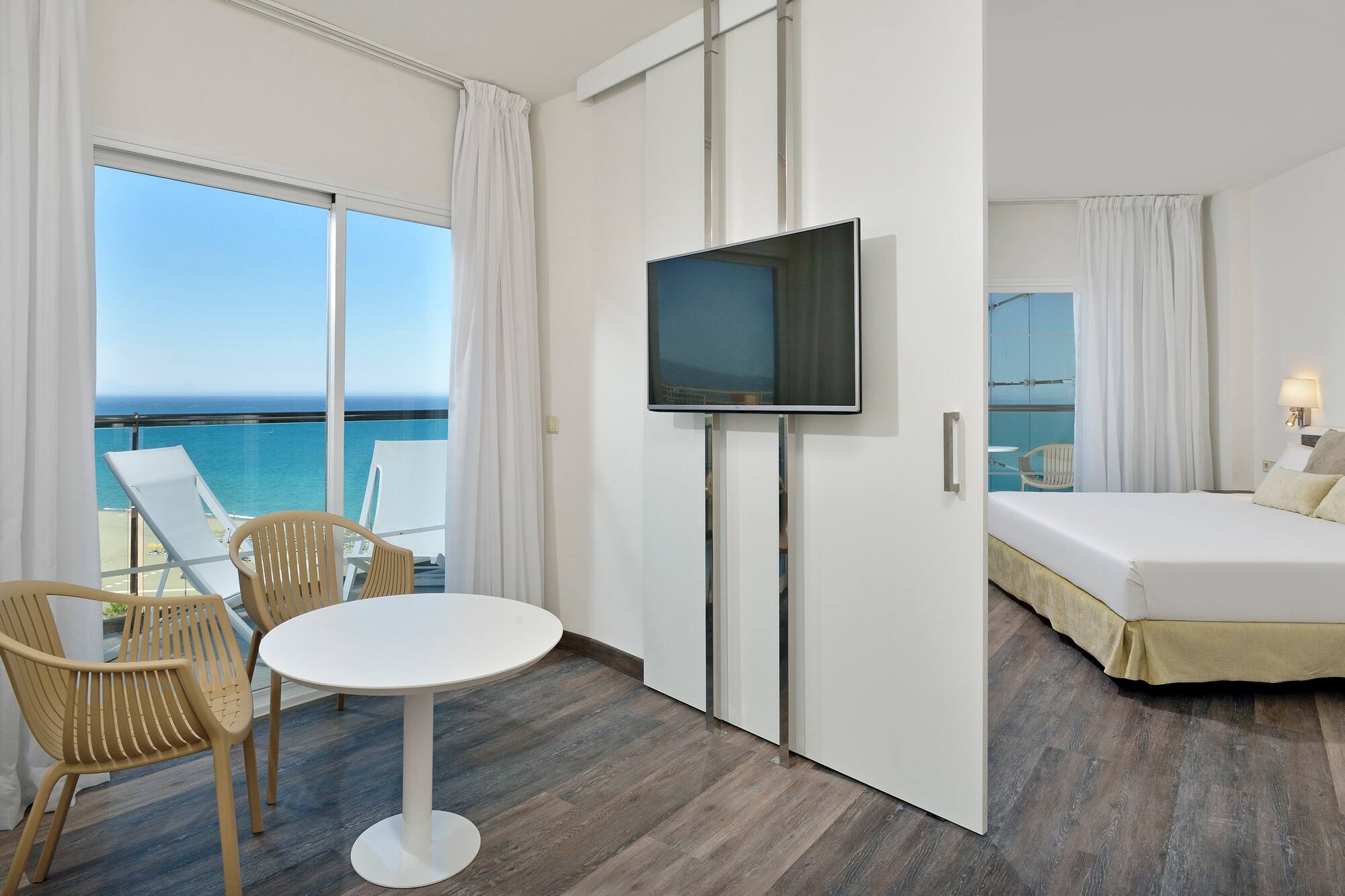 a room with a television and a bed