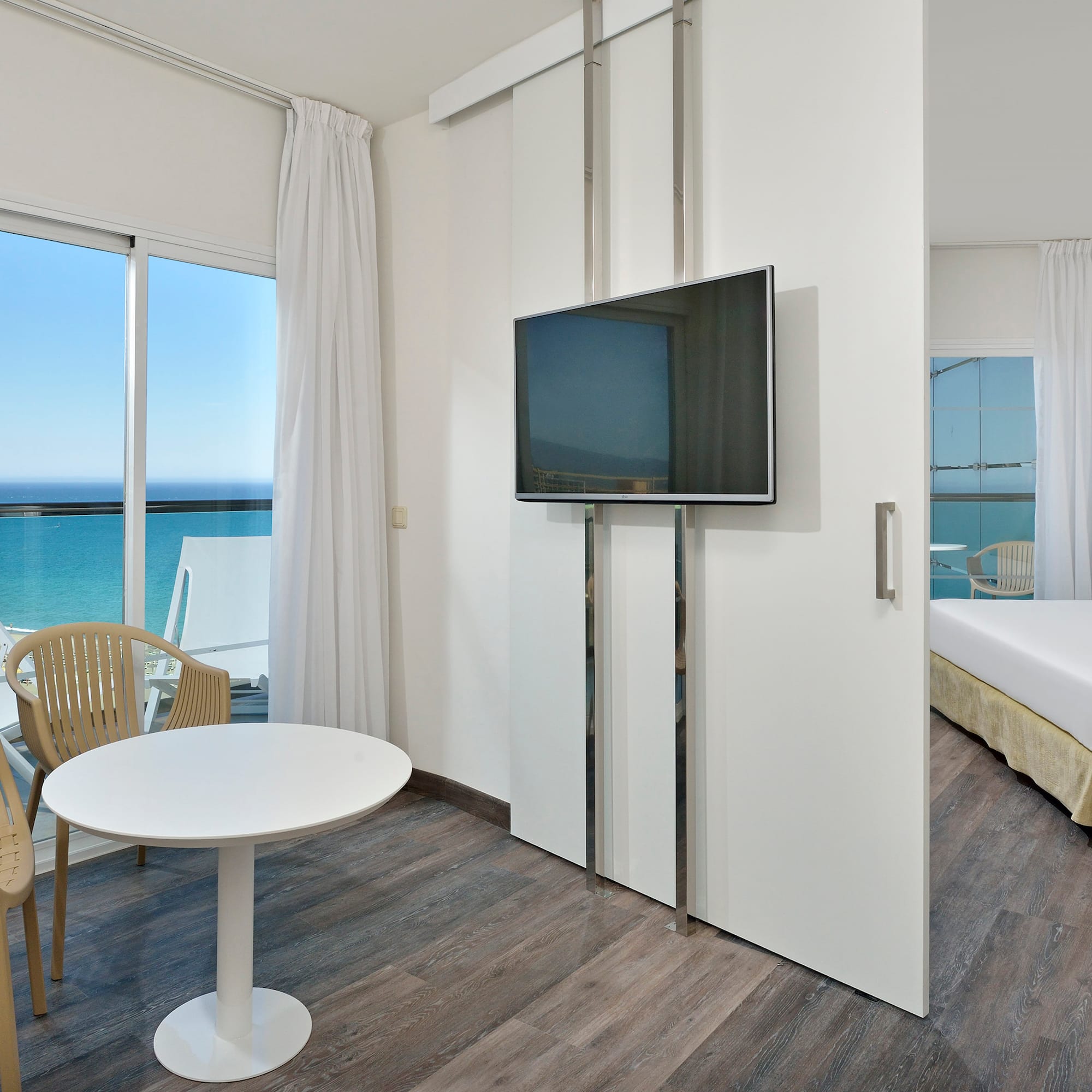 a room with a television and a bed