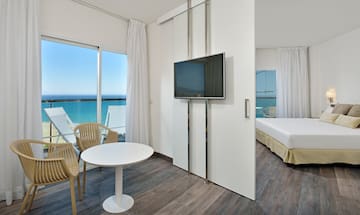 a room with a television and a bed