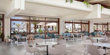 a room with tables and chairs