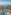 Luxury beachfront resort with multiple swimming pools, palm trees, and ocean view.
