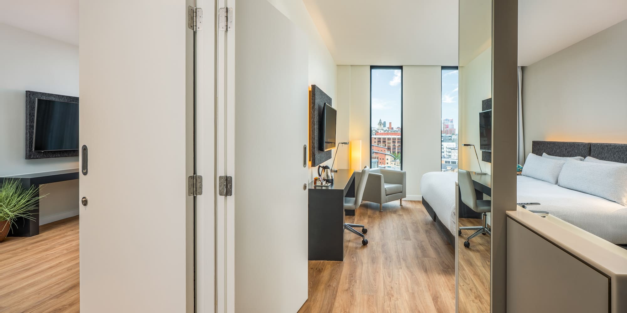 a room with a bed and a desk