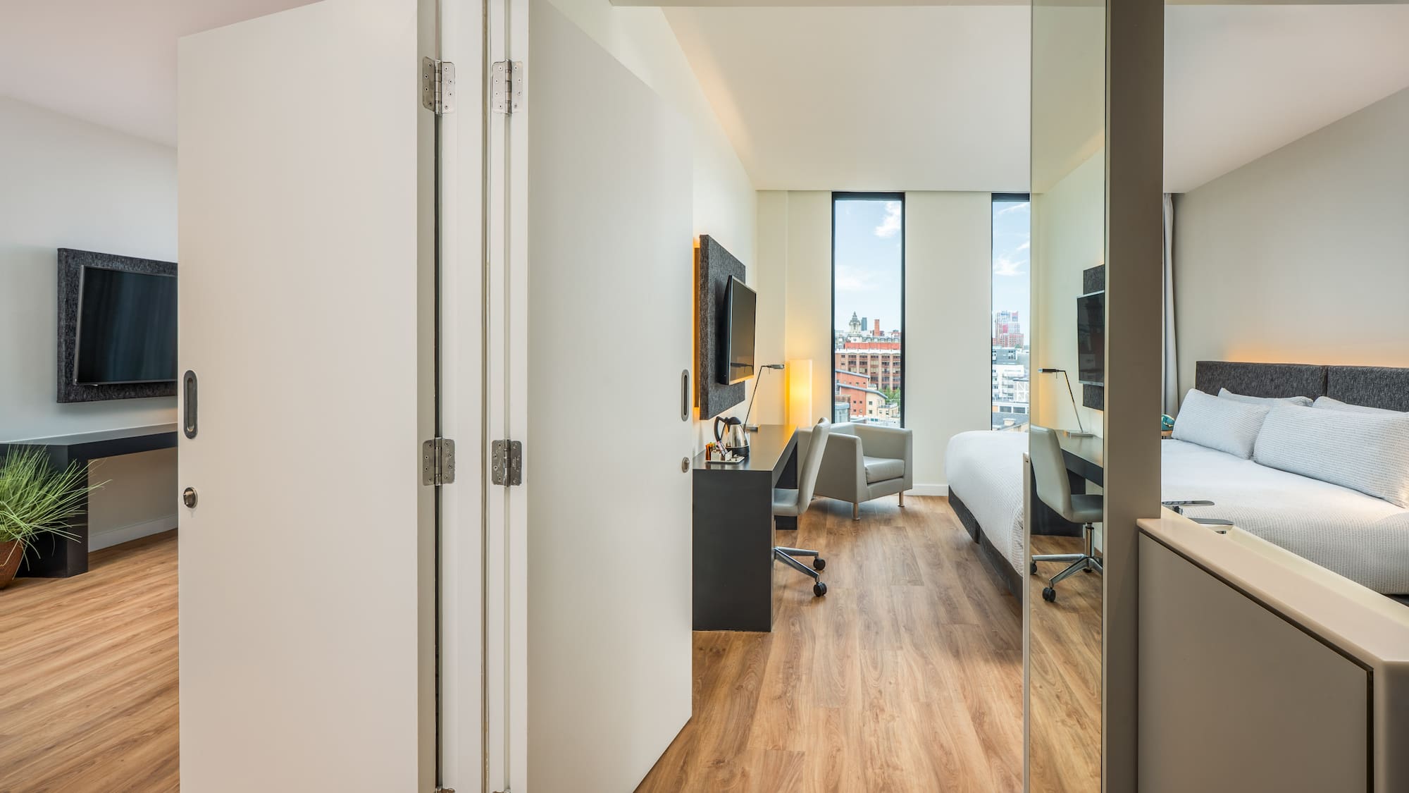 a room with a bed and a desk