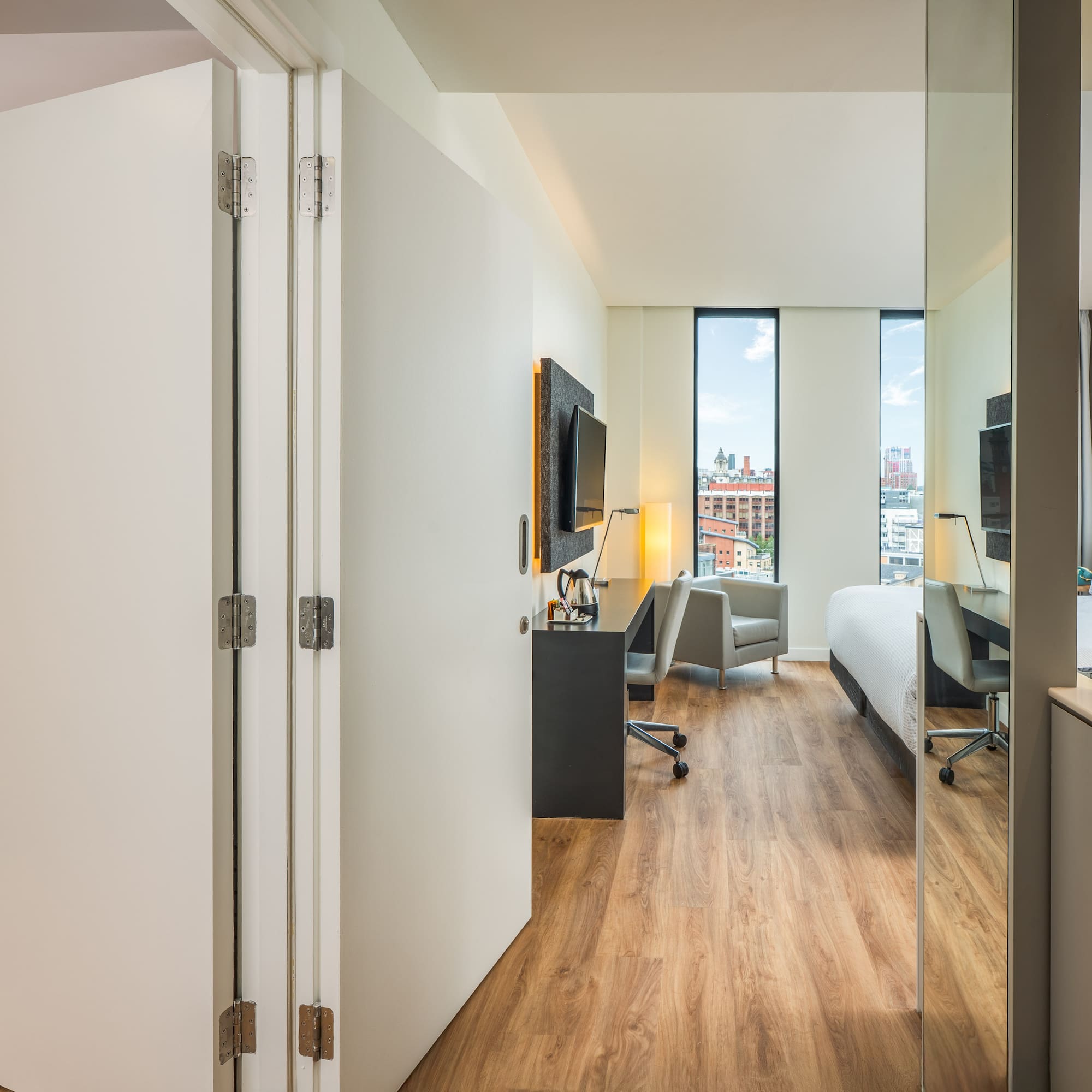 a room with a bed and a desk