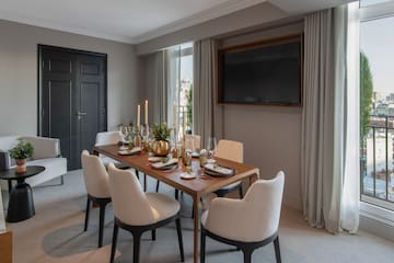 a dining table with candles on it