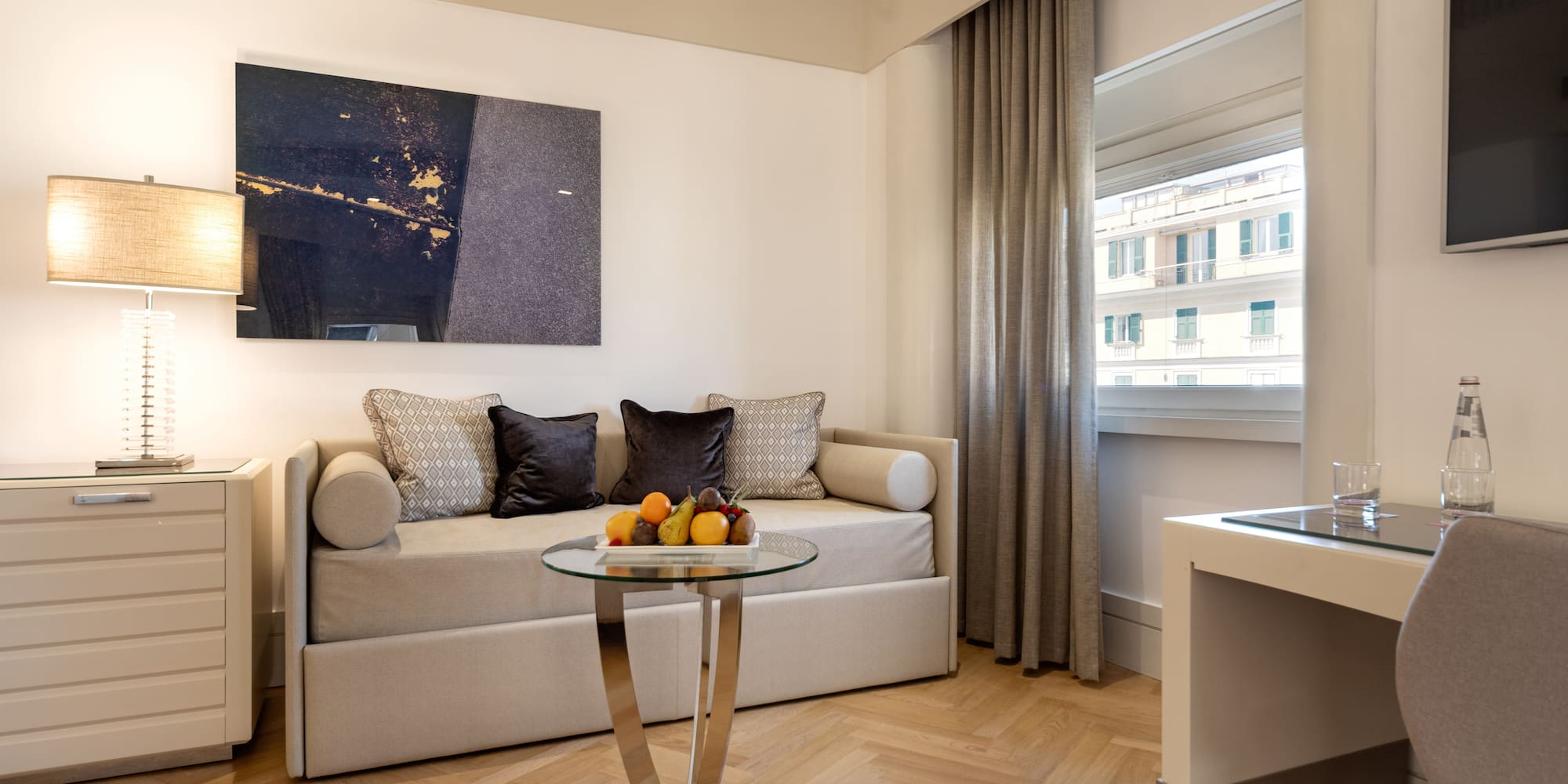 a room with a couch and a glass table